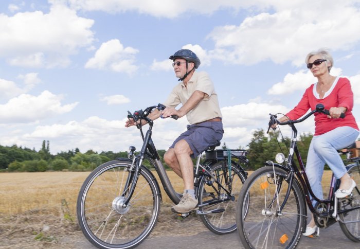 elderly couple cycling