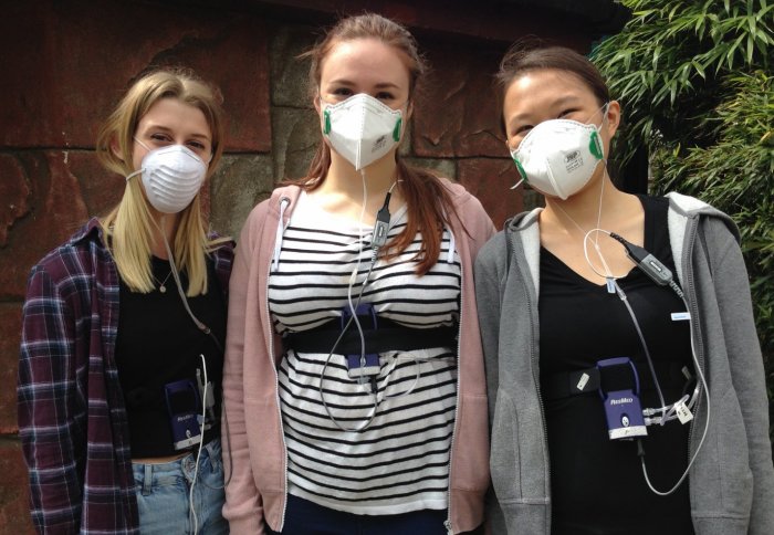 Biomedical science students wearing face masks and medical equipment