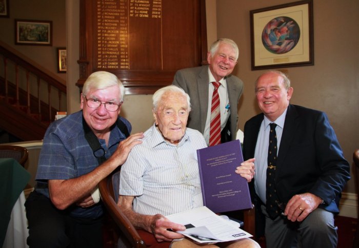 Dr David Goodall with fellow alumni after receiving his newly bound thesis