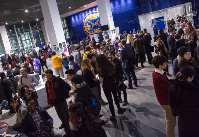 A crowd of people gather in the main entrance of Imperial's South Kensington Campus