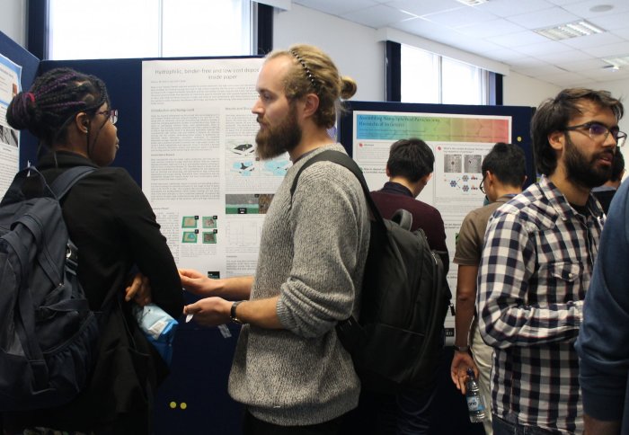 PE-CDT students take part in poster session at symposium with active discussions