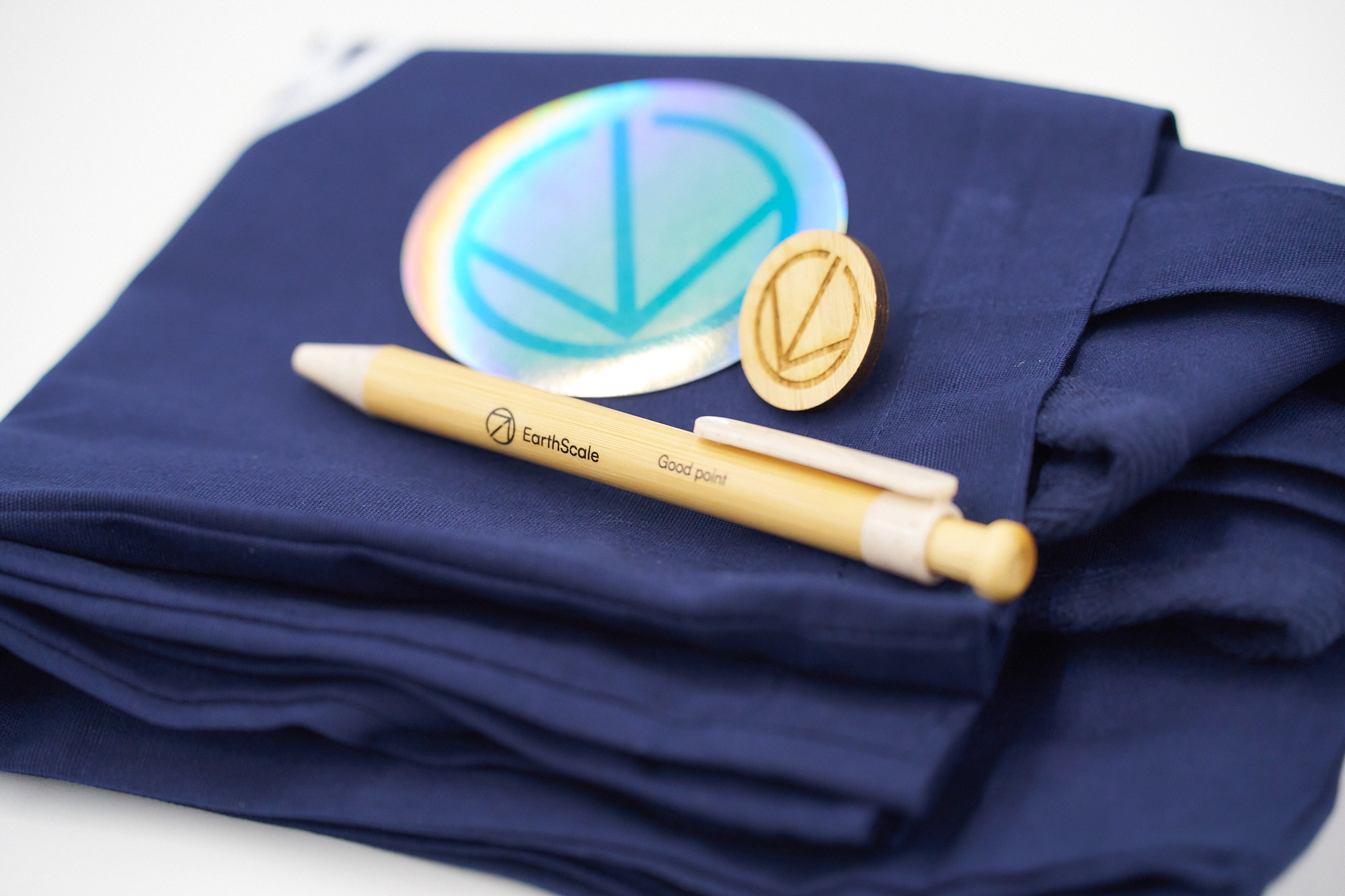 A pen with the logo for the EarthScale climate tech programme.