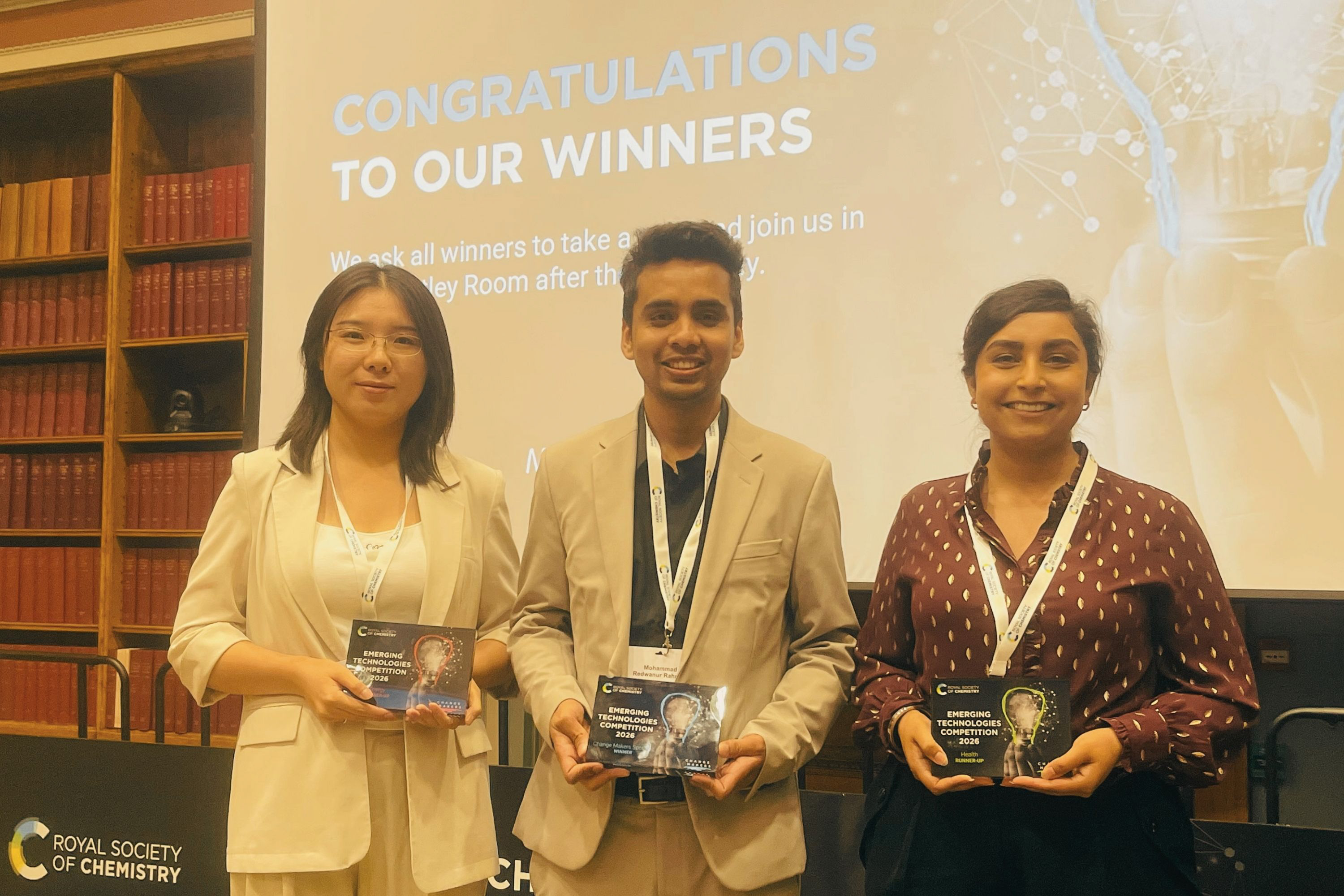 People holding an award