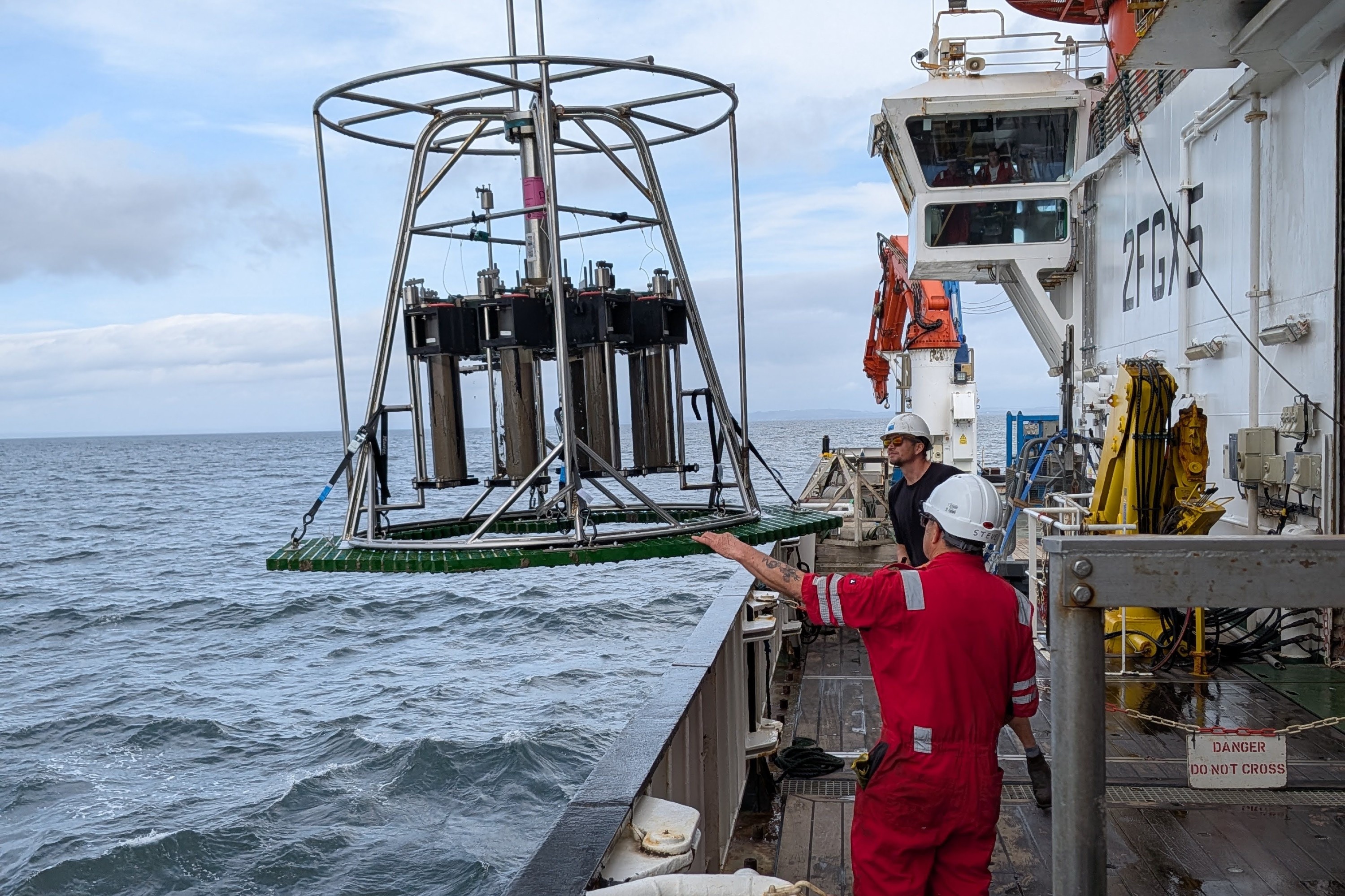 Measuring equipment for the SeaSTORE project being lowered by researchers into the Irish Sea.