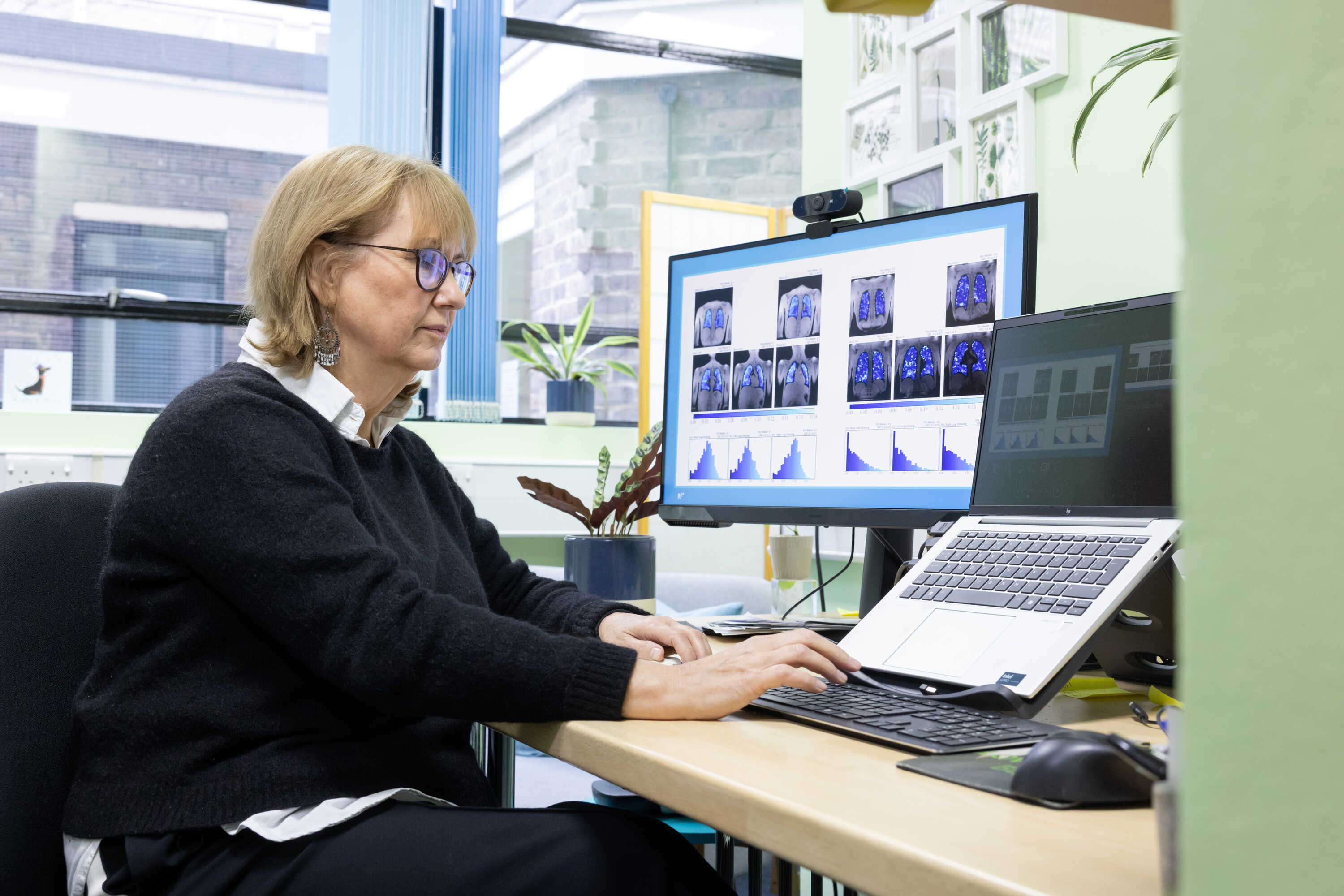 Professor Jane Davies sat at her desk