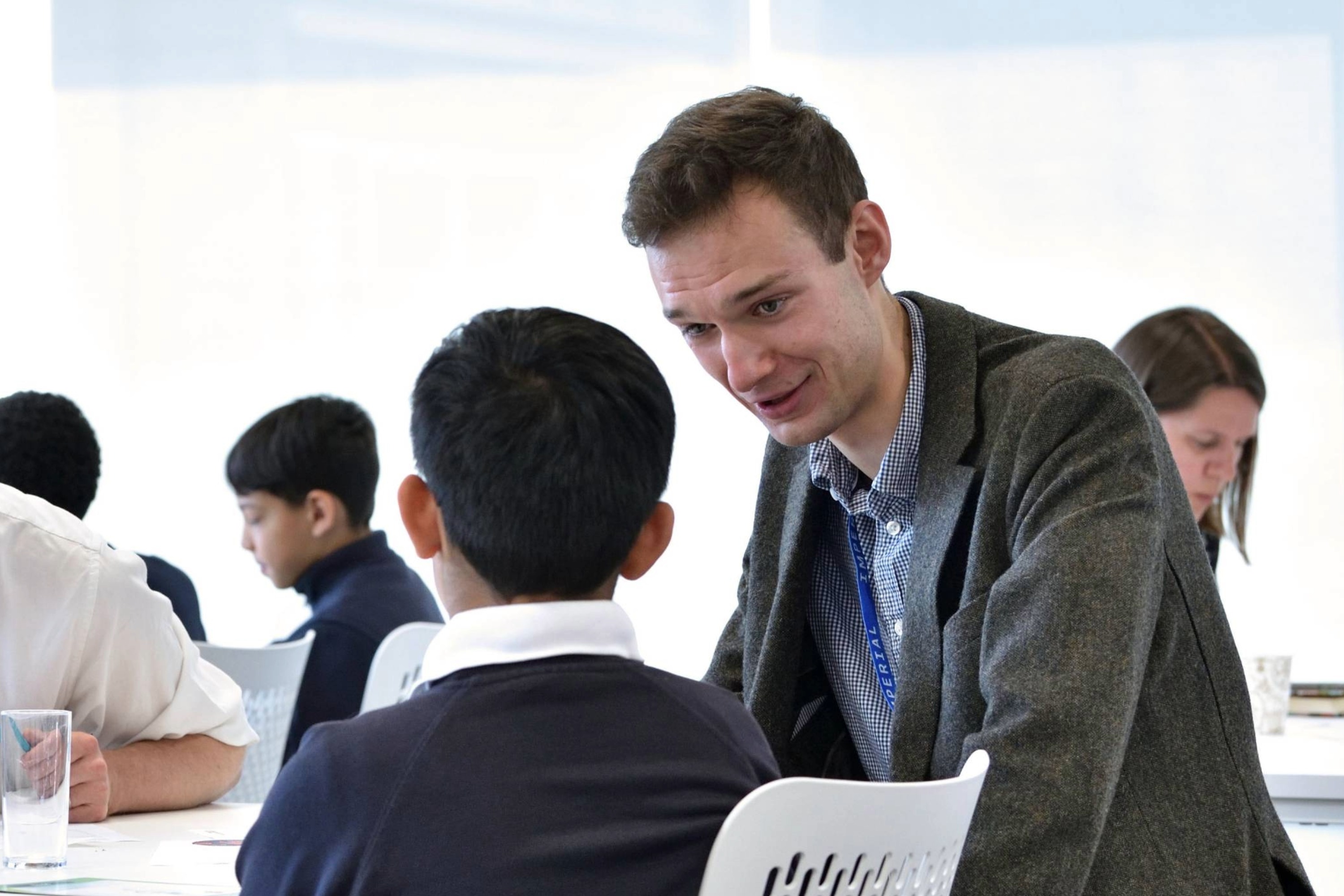 George Melrose speaking with primary school child