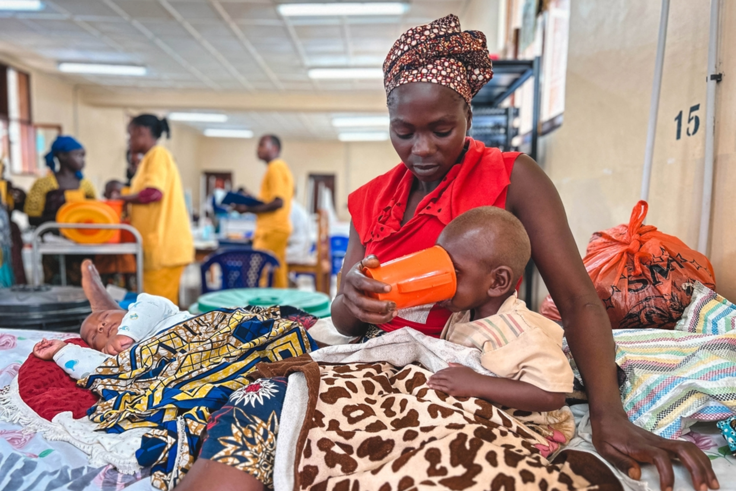 A mother giving a child fluids