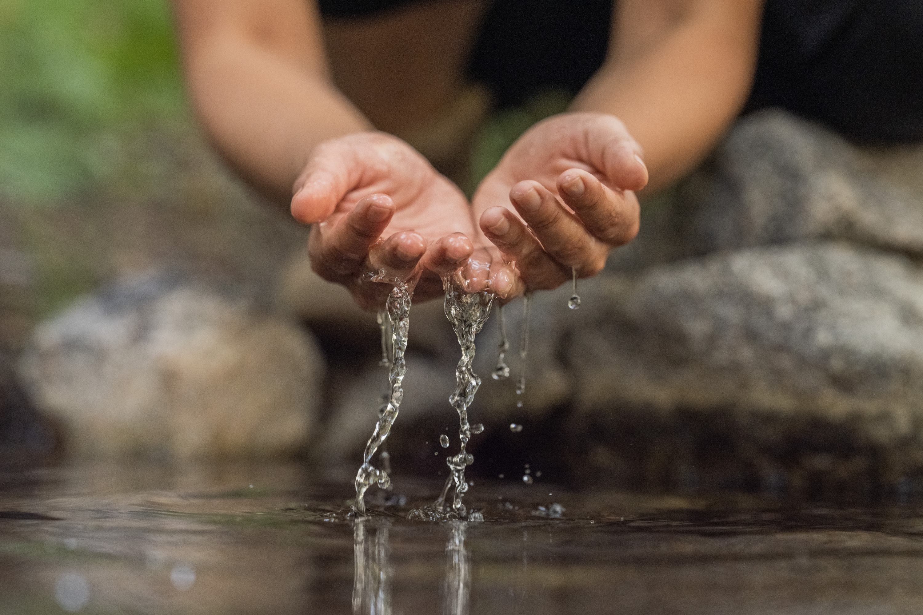 Hands in water