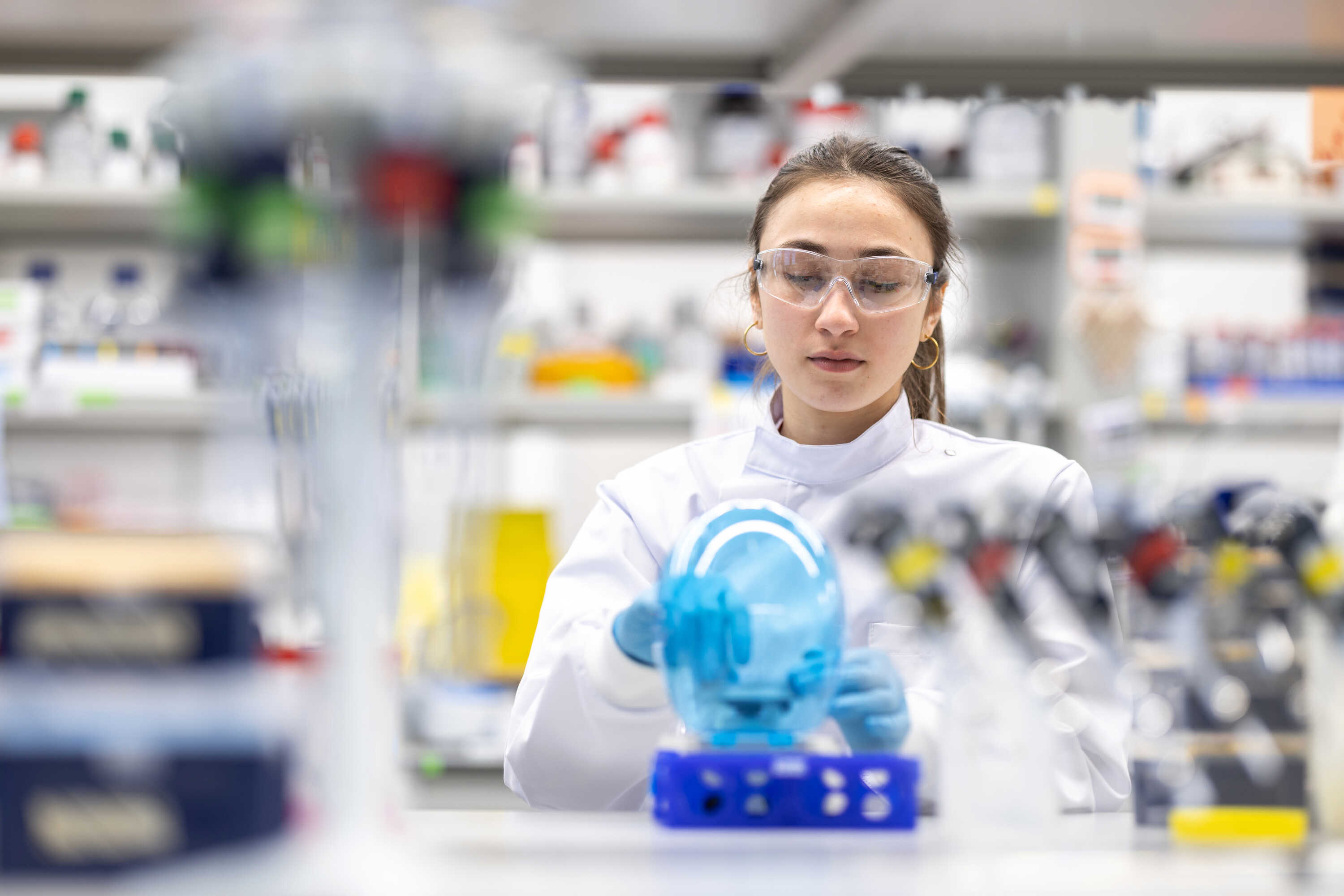 Researcher in UK DRI lab processes samples
