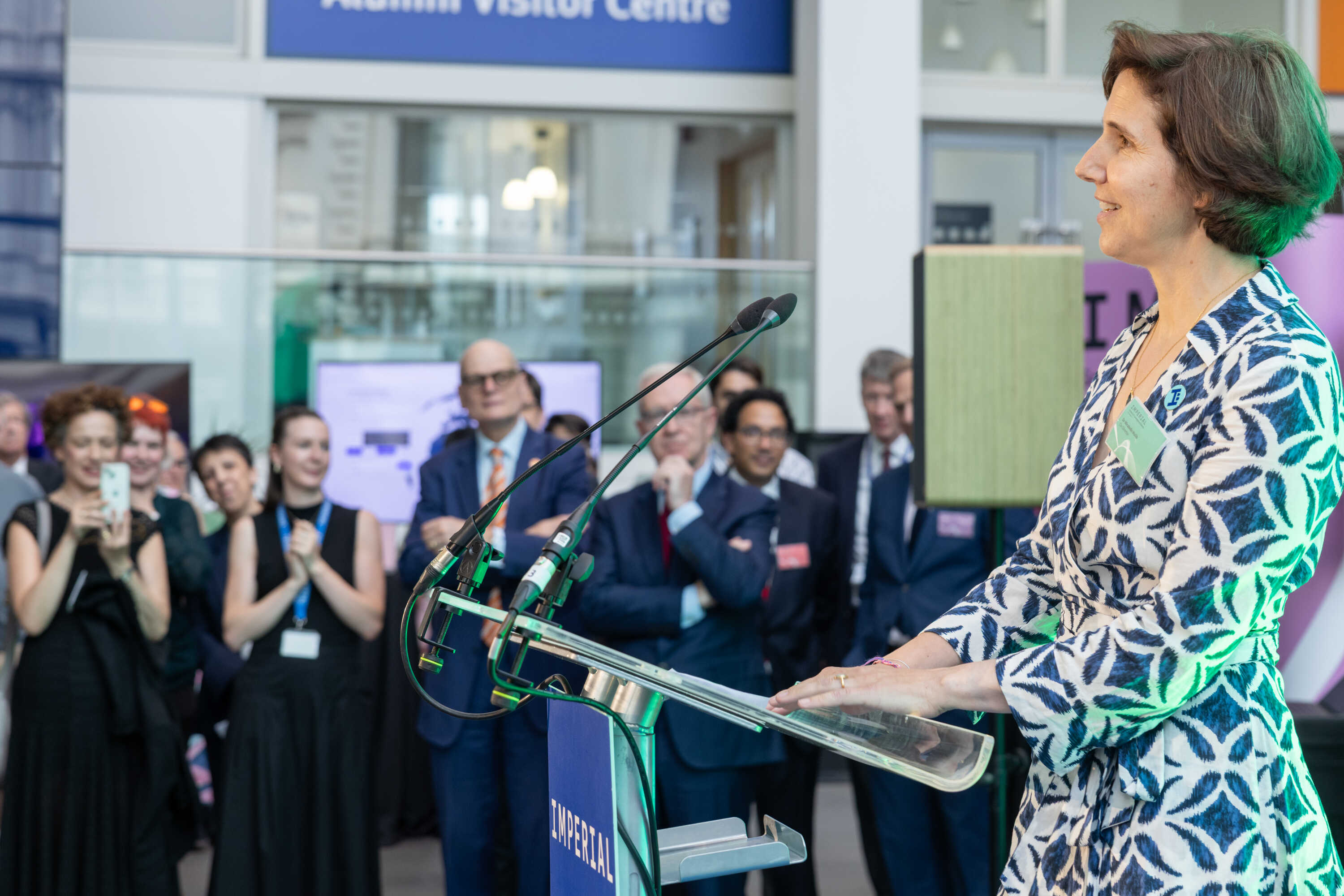 School of Convergence Launch Mirabelle Muuls presenting as other staff members watch from the audience