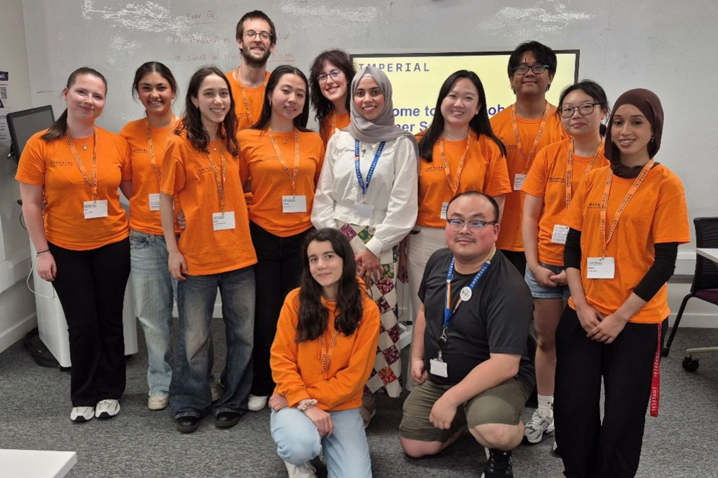 Group of people in orange tshirts
