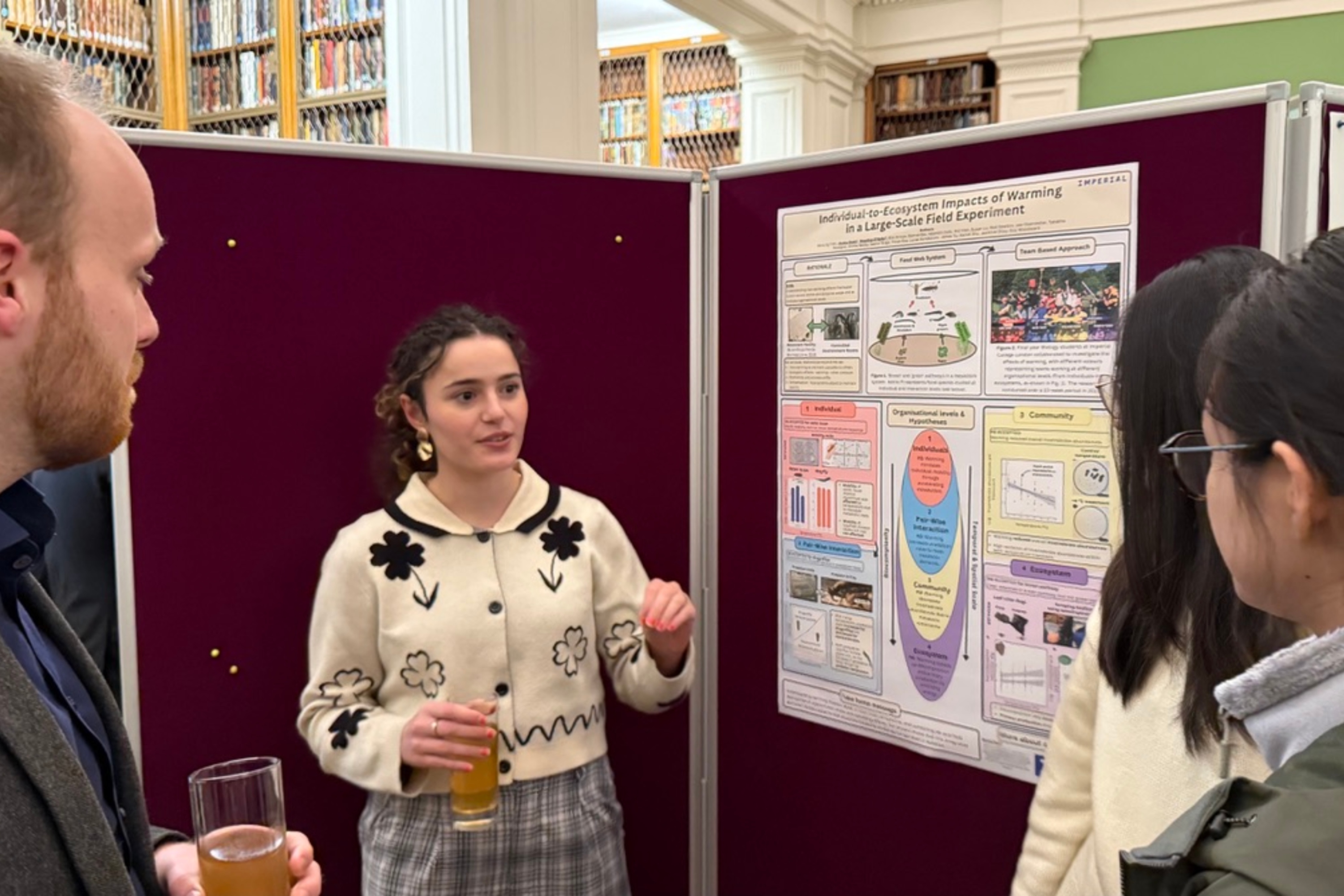Students presenting their poster at the Linnean Society Meeting