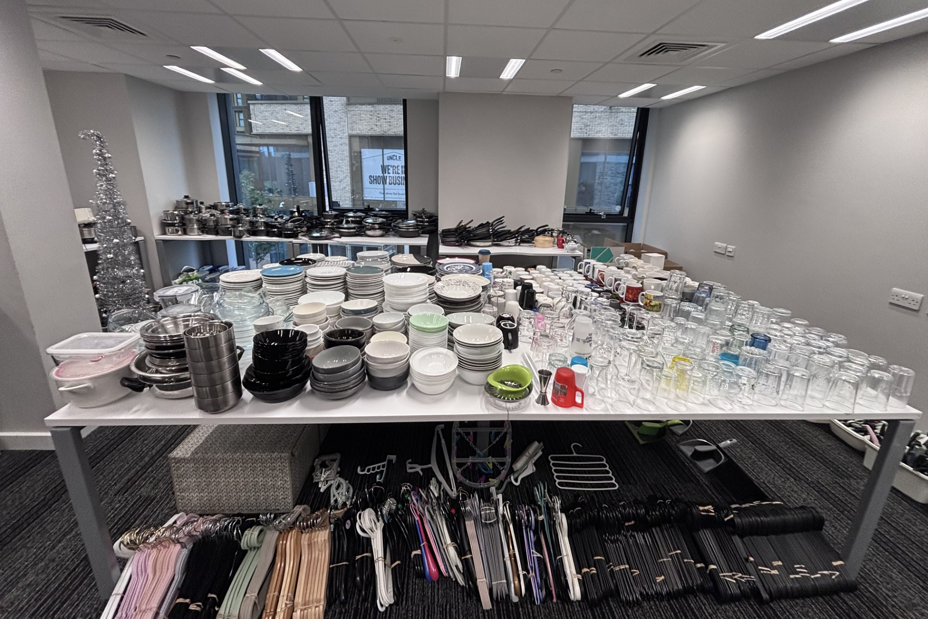 Room filled with neat piles of pre-loved items