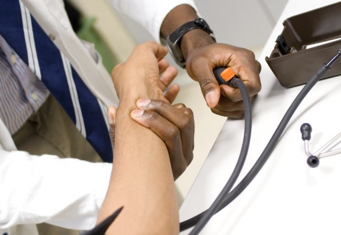 Medical student checking pulse