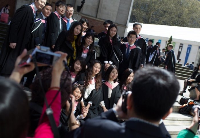 Students on the Queen's Tower steps 