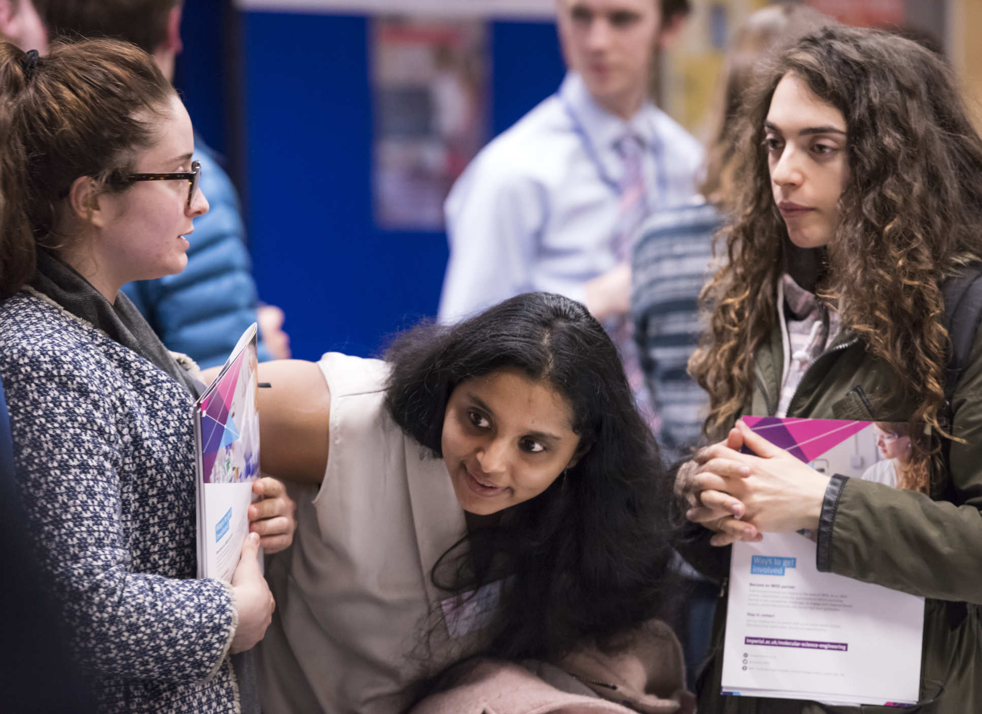 Women discuss an IMSE briefing paper