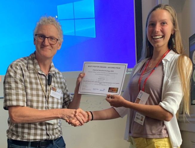 Danielle Kurtin shaking hands with Simon Schultz