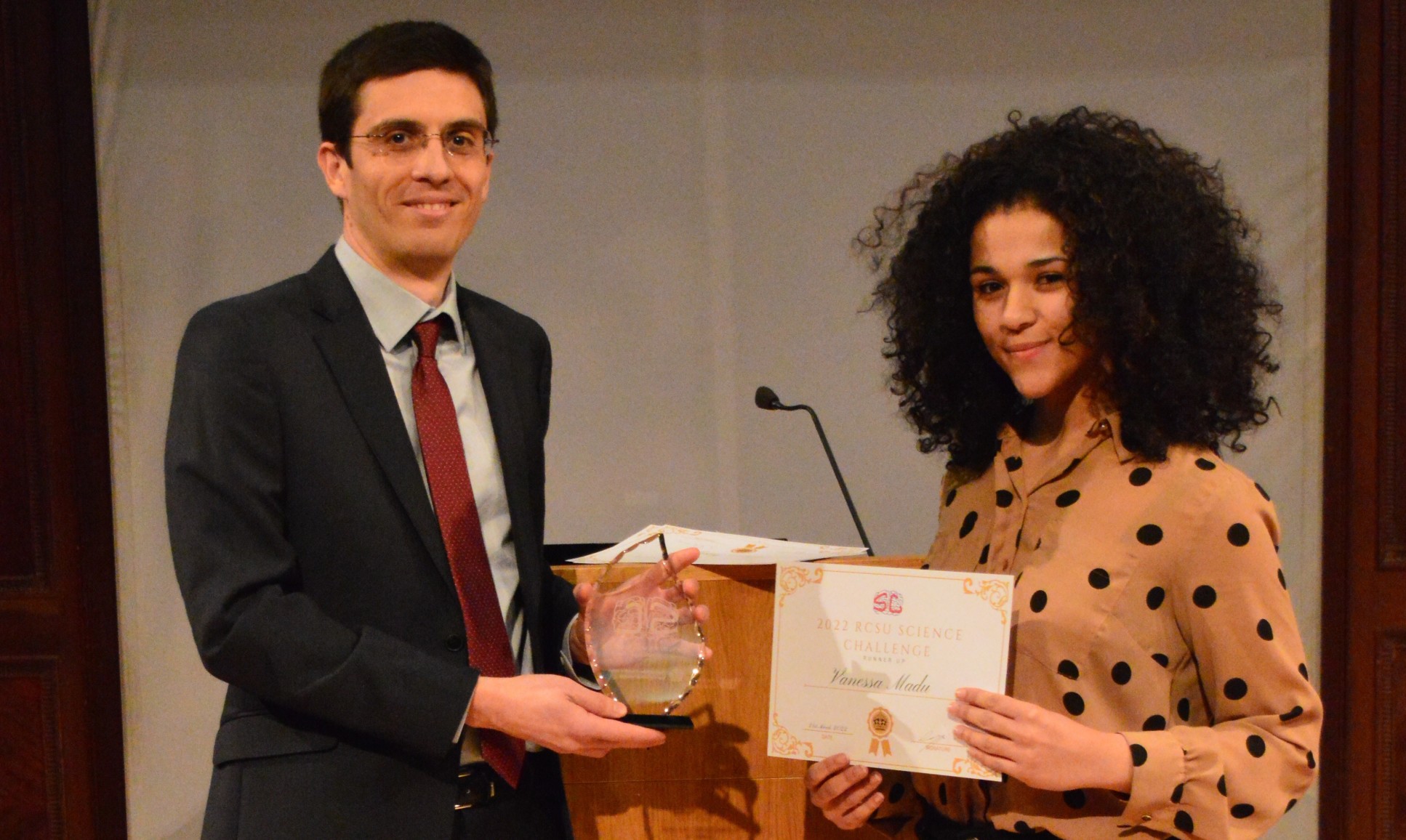 Vanessa Madu receives an award as Overall Imperial Winnerv