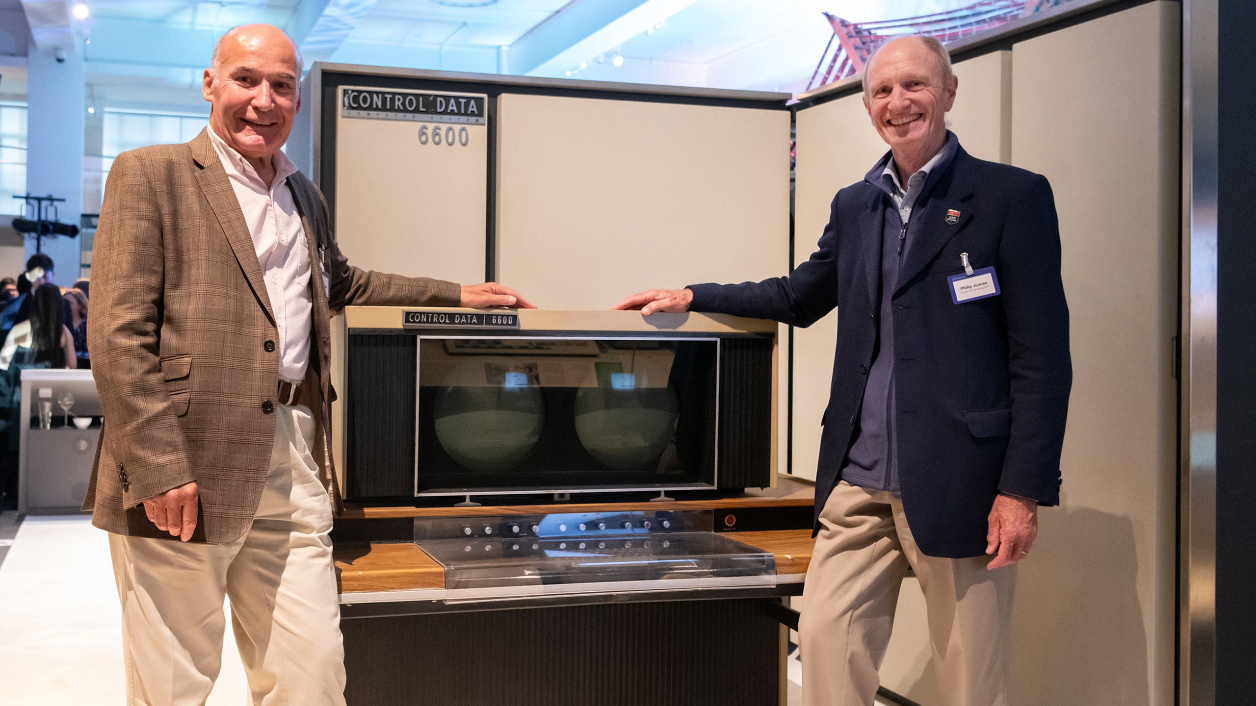 Philip Jeanes (Aeronautics 1973), right, pictured with old friend the CDC6600 supercomputer during the Annual Alumni Celebration in the Science Museum.