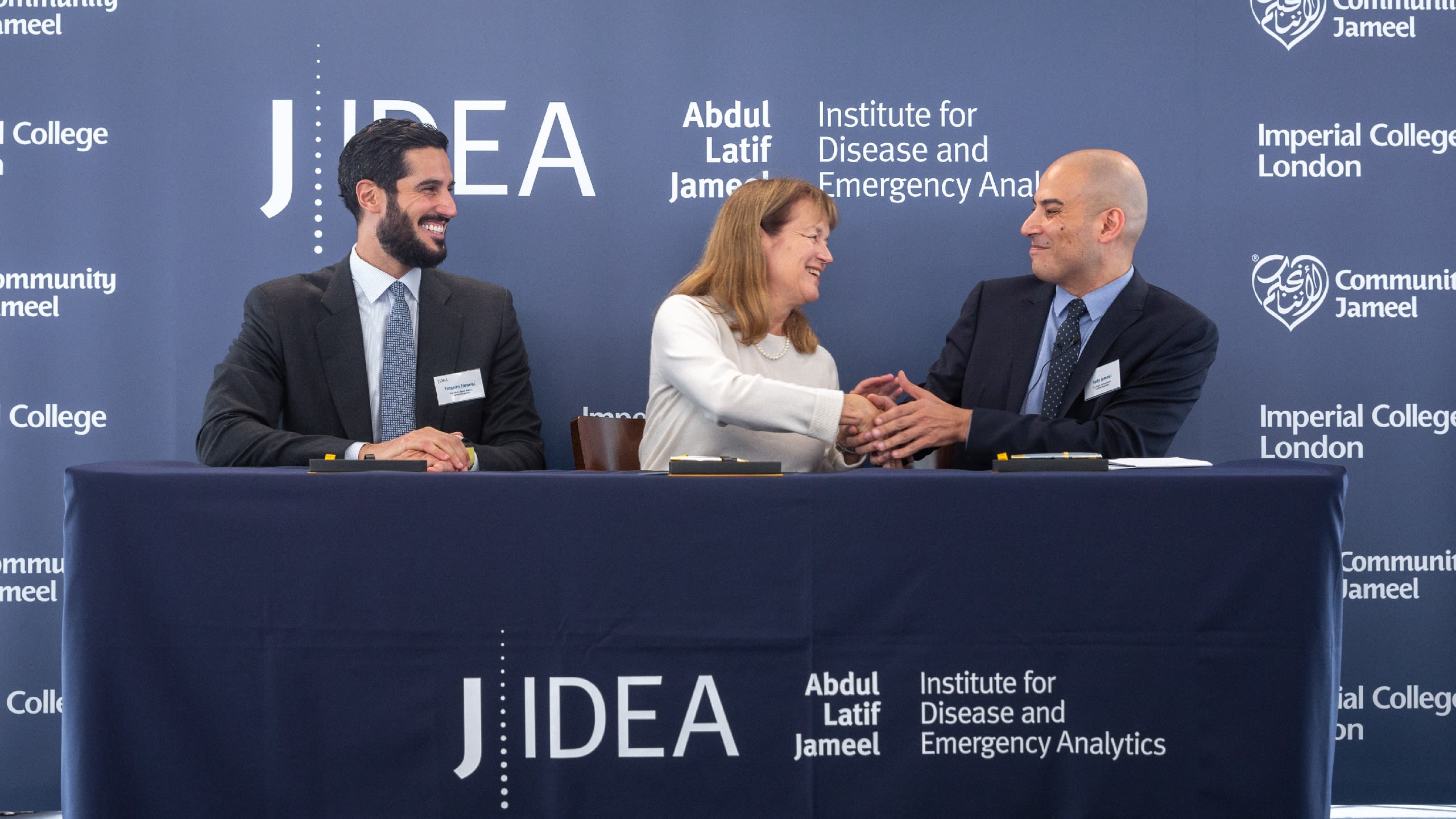 Alice shaking hands with guests