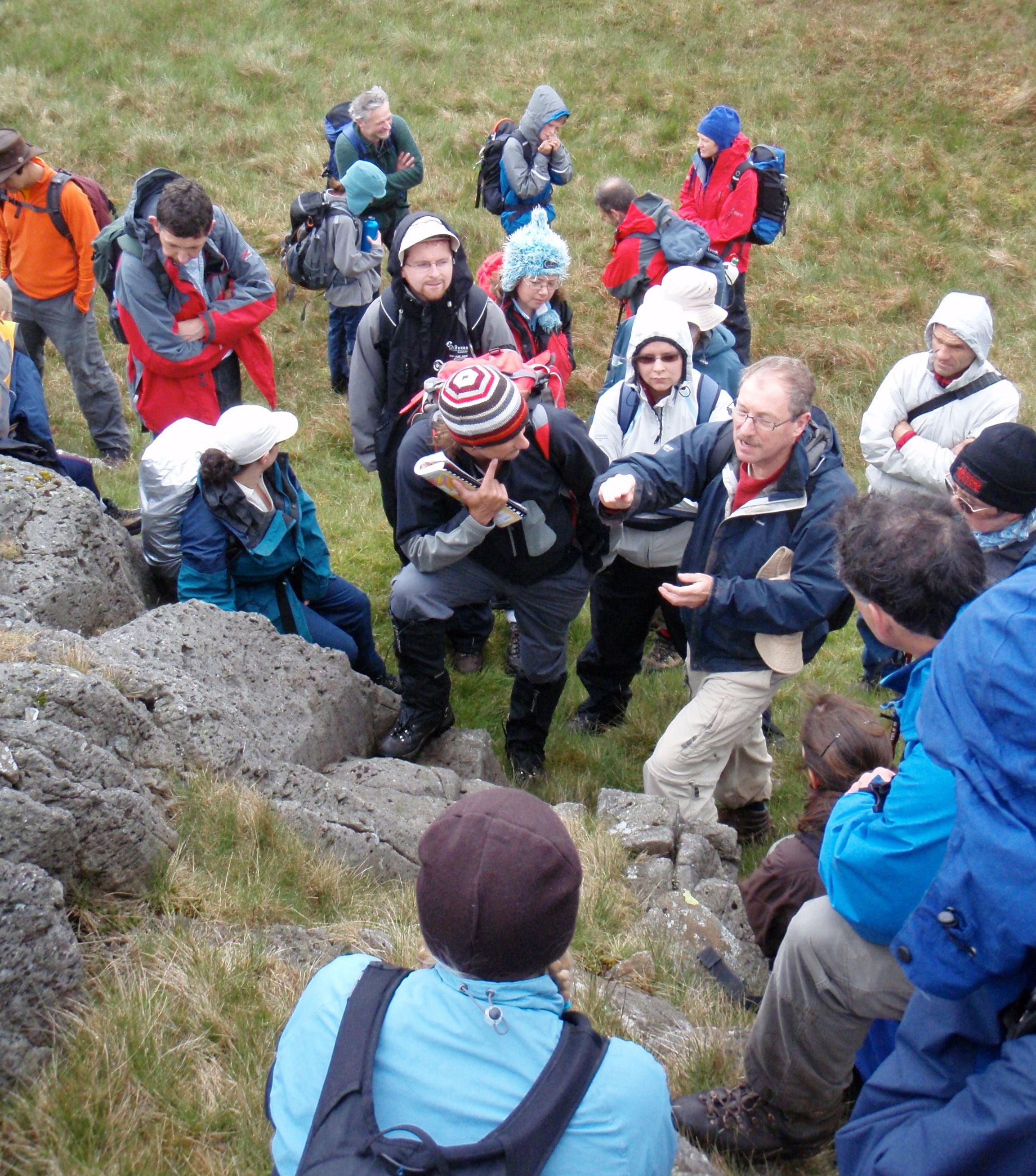Stephen surrounded by students on a hill in the Lake District