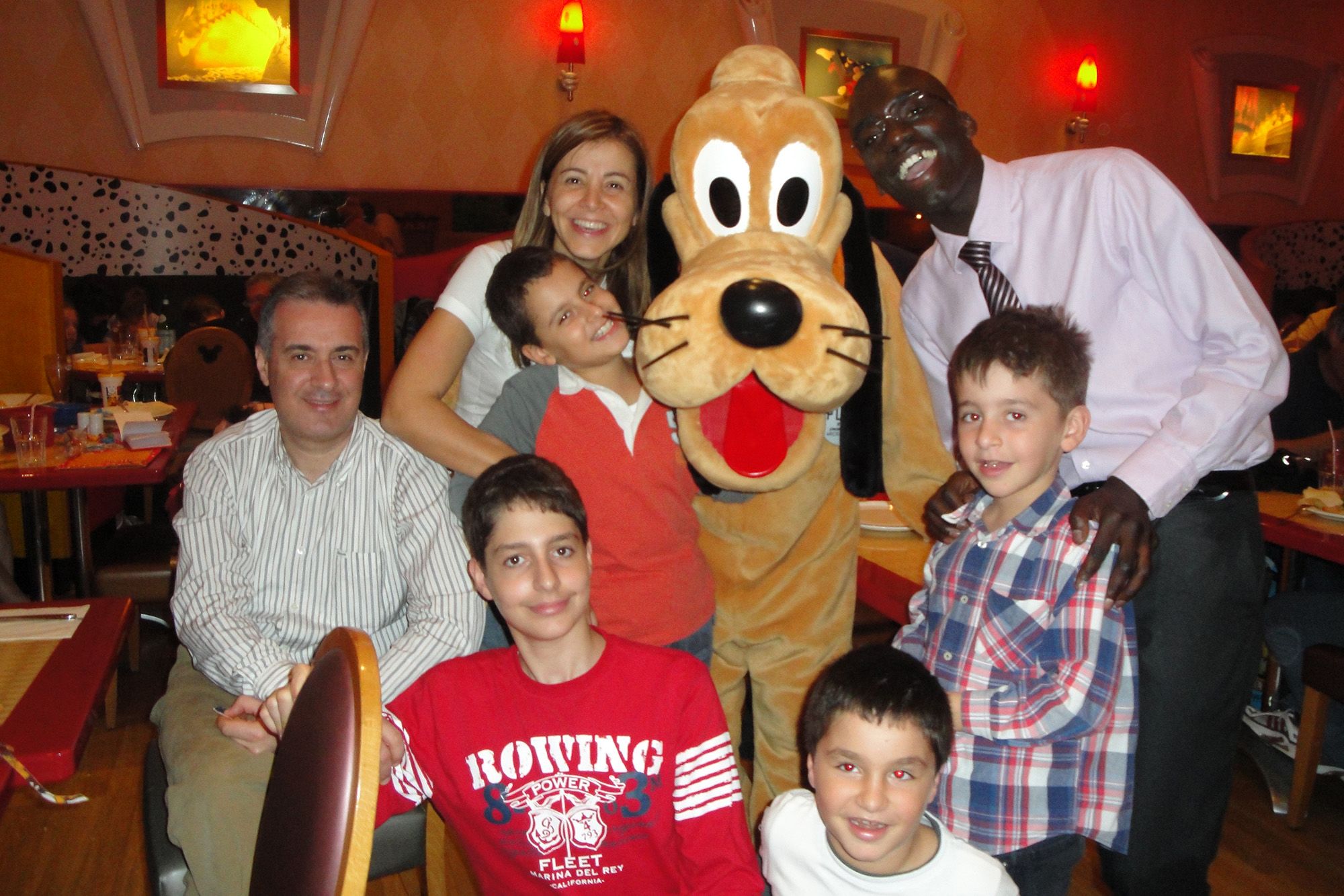 A young Jean Marc and his family at Disneyland.