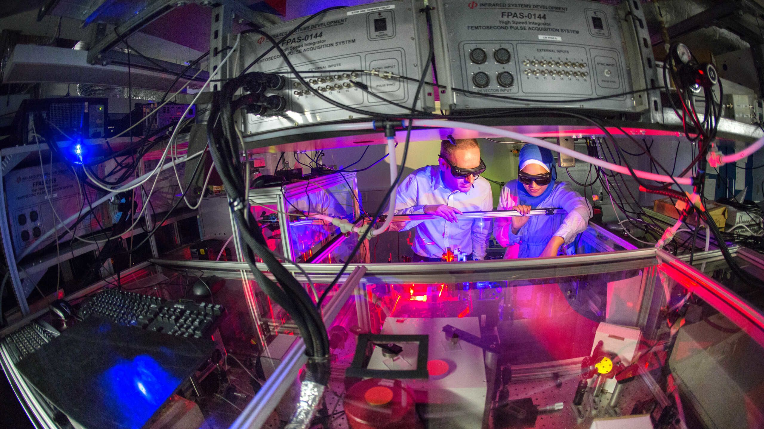 Two scientists in a laser lab