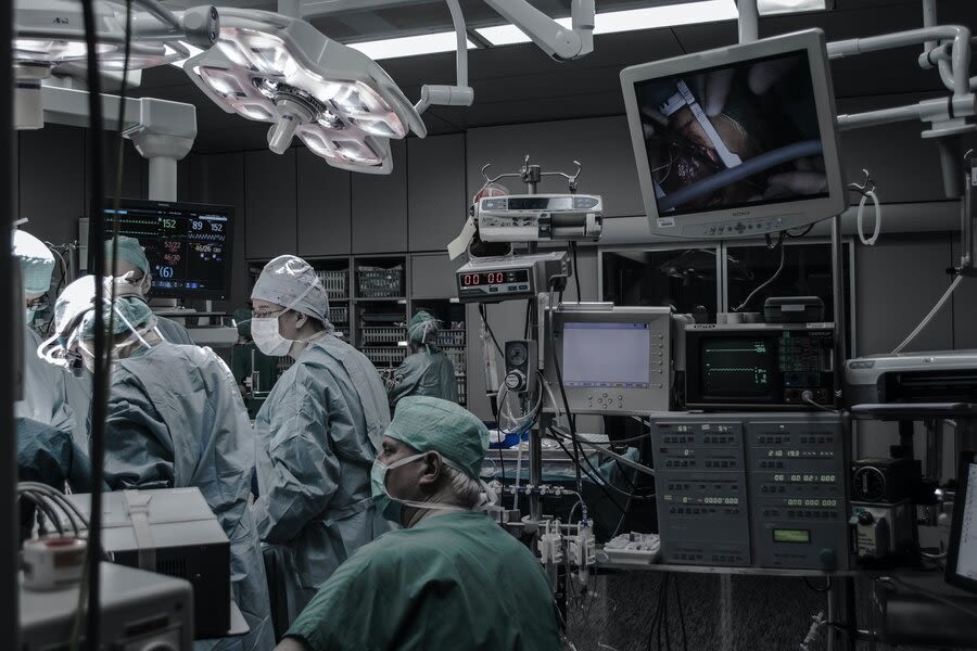 a group of surgeons in a operating room