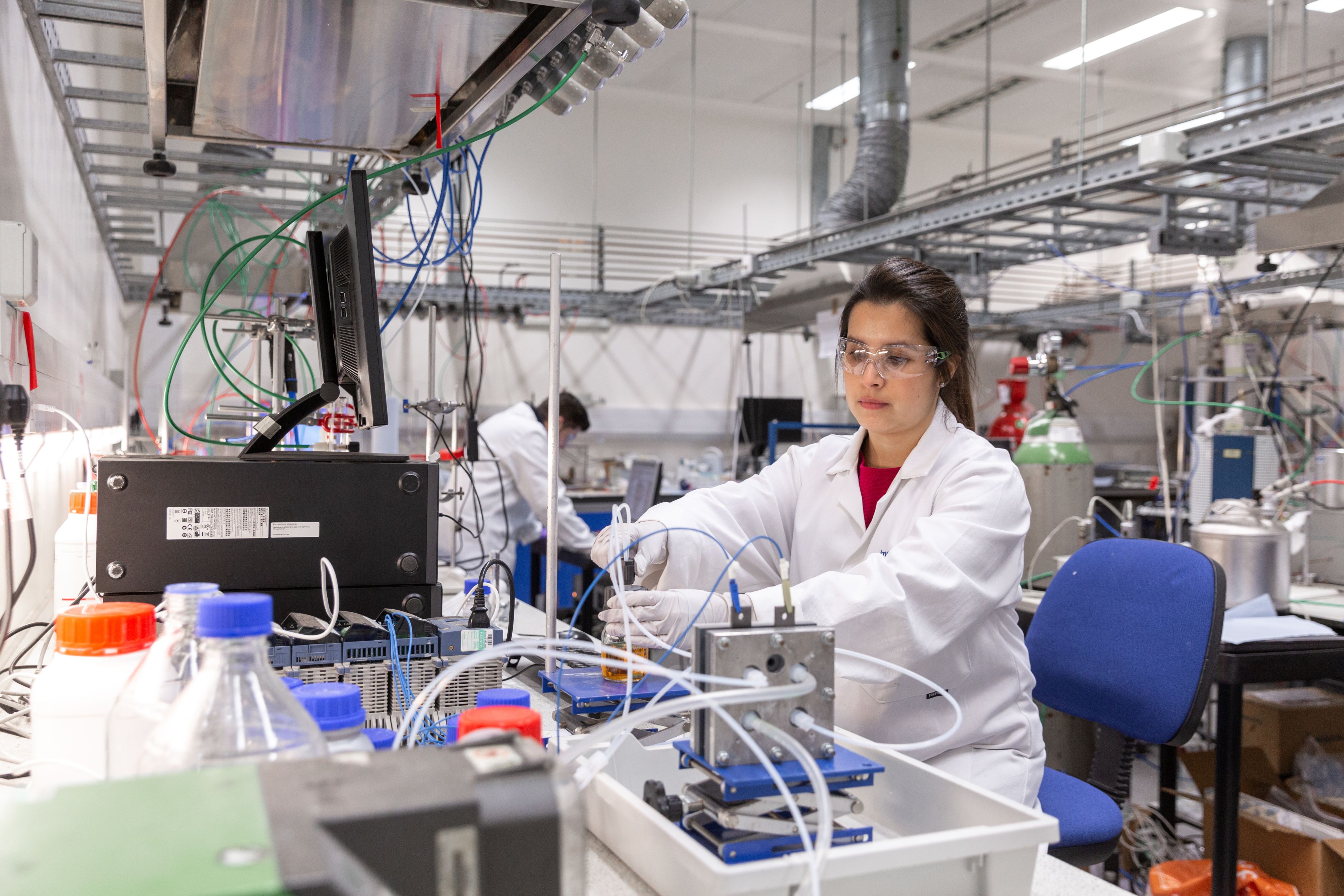 Picture of a lab technician working on a battery