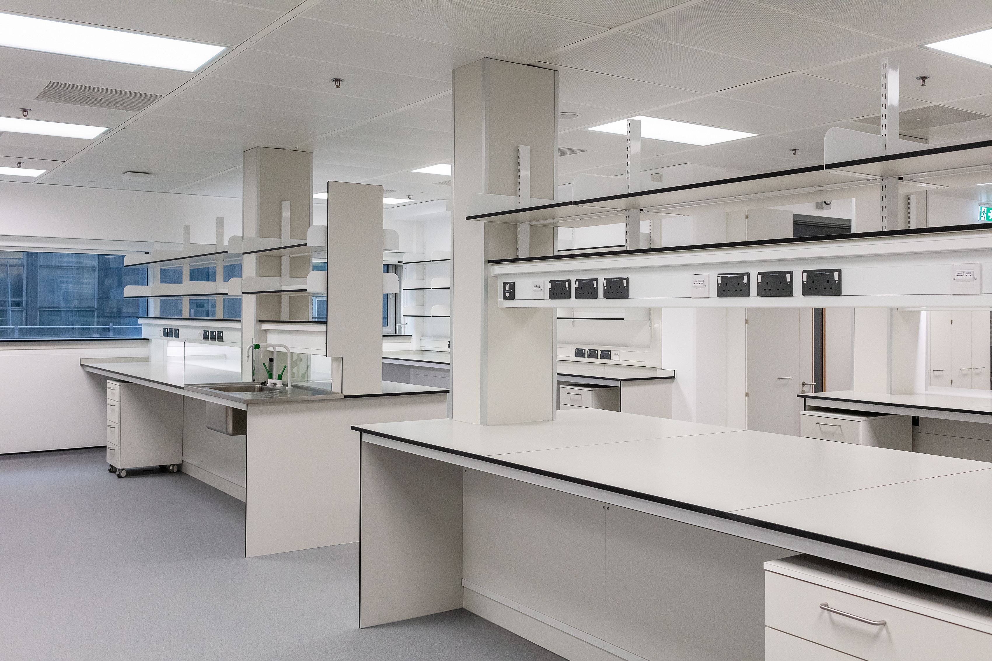 Workbenches with above counter shelving and powerbanks