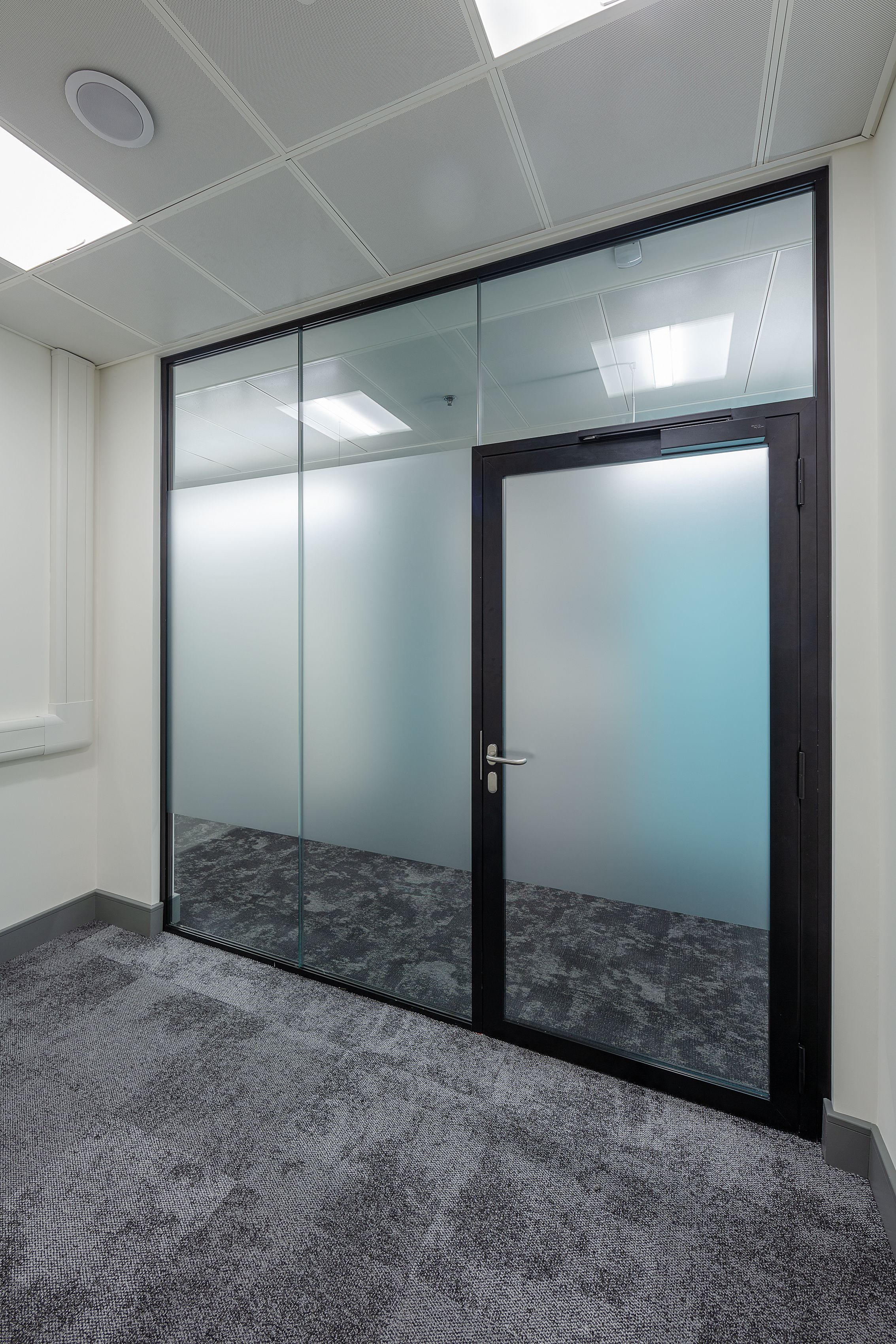 A frosted glass office area