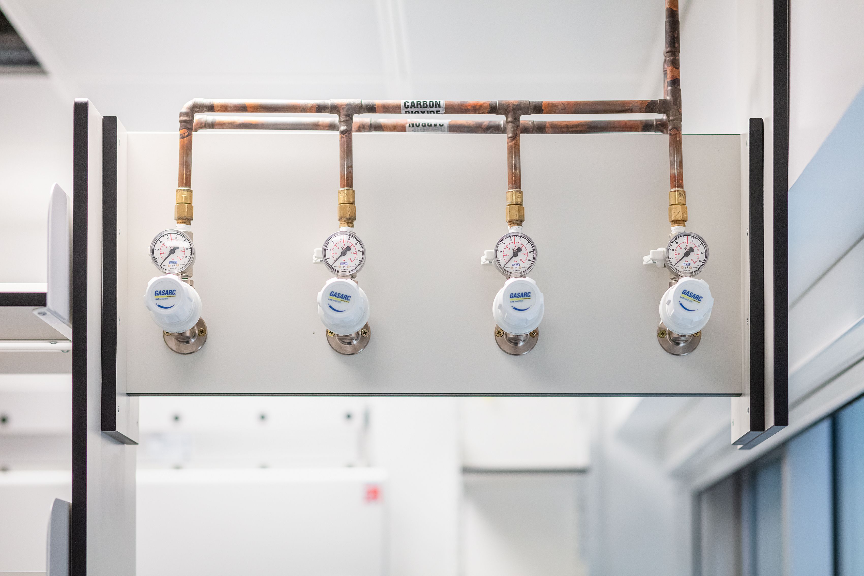 a gas control panel with four dials and knobs