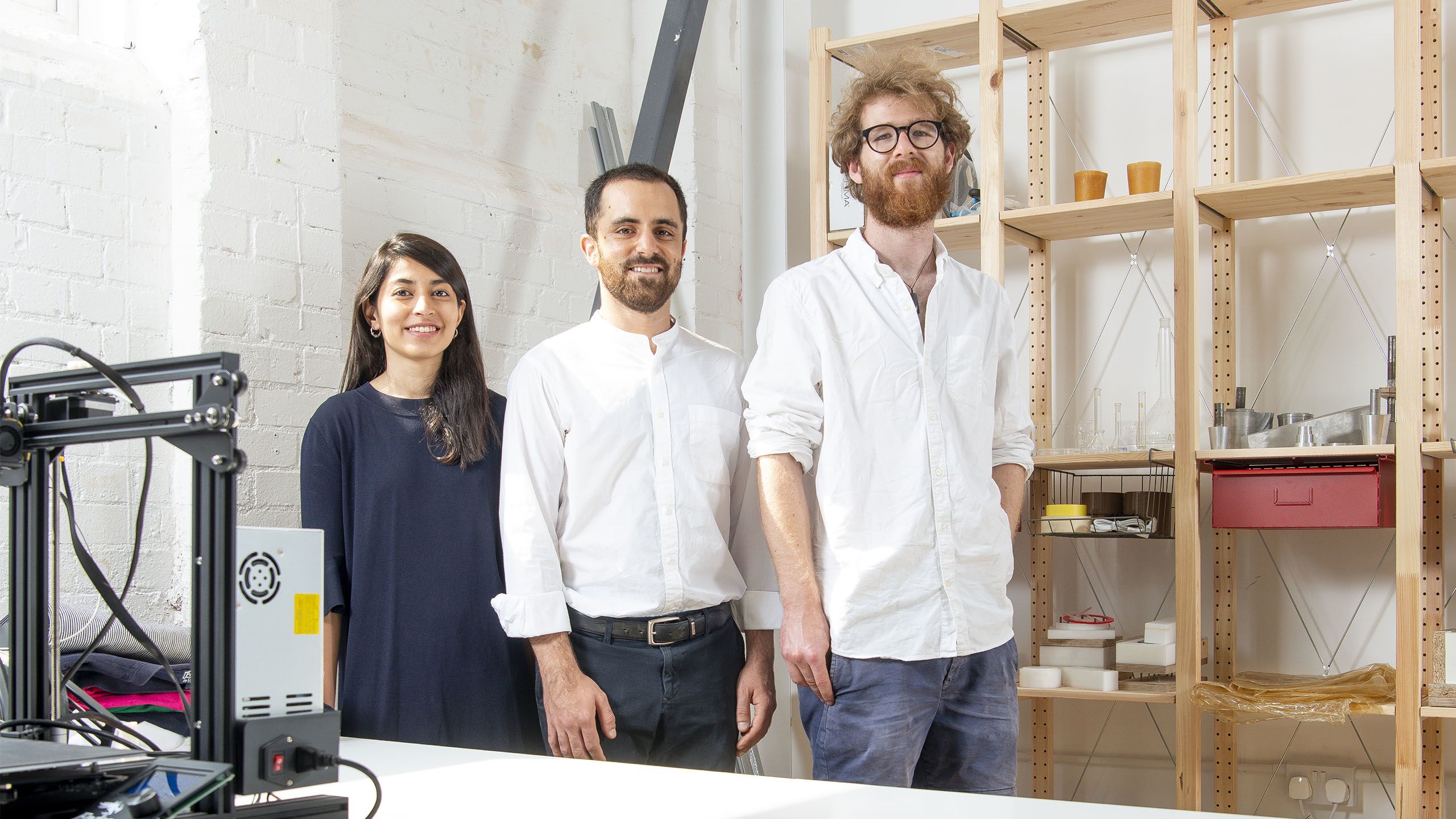 Founders of The Shellworks, posing in a workshop environment.