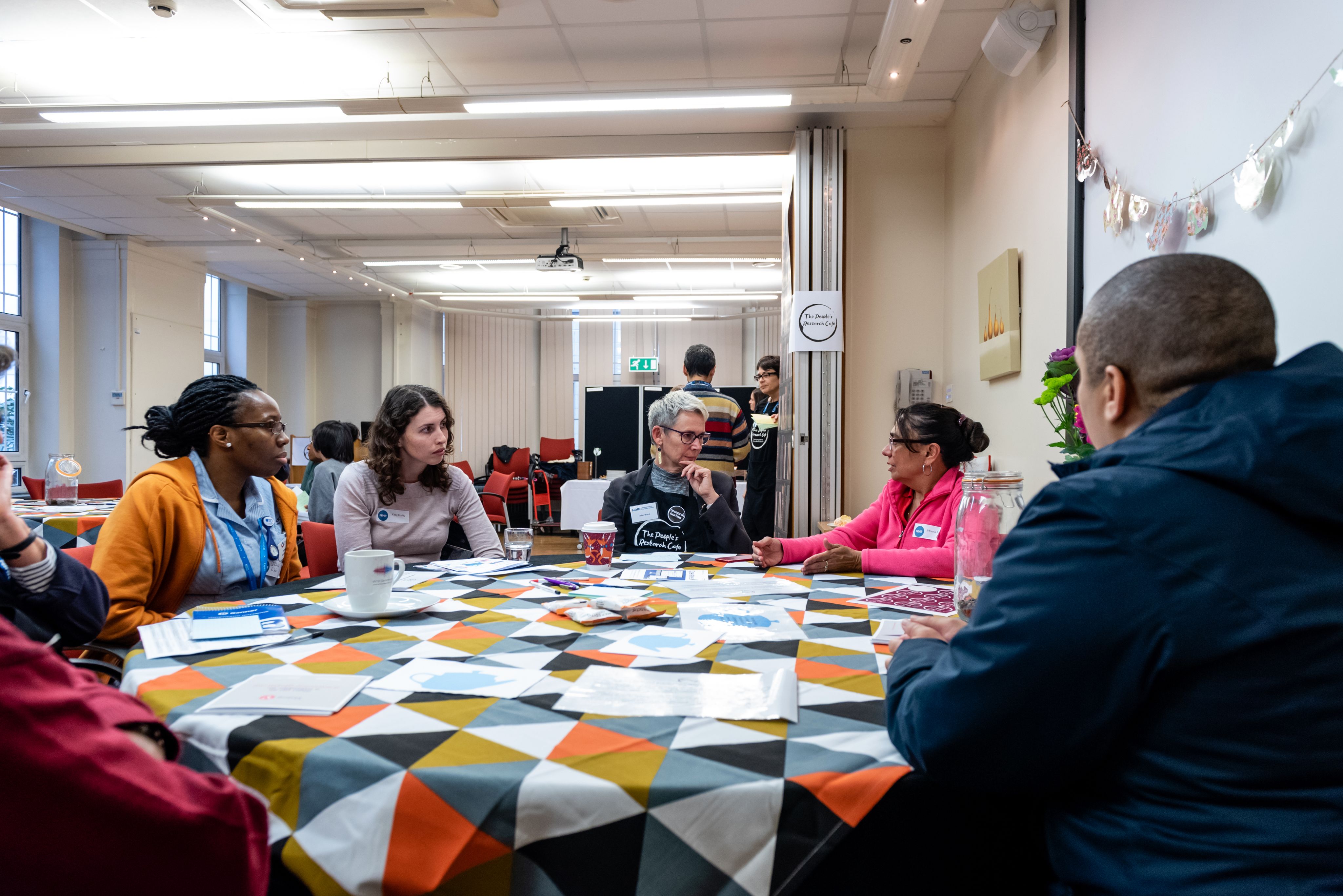 People having conversations at a table