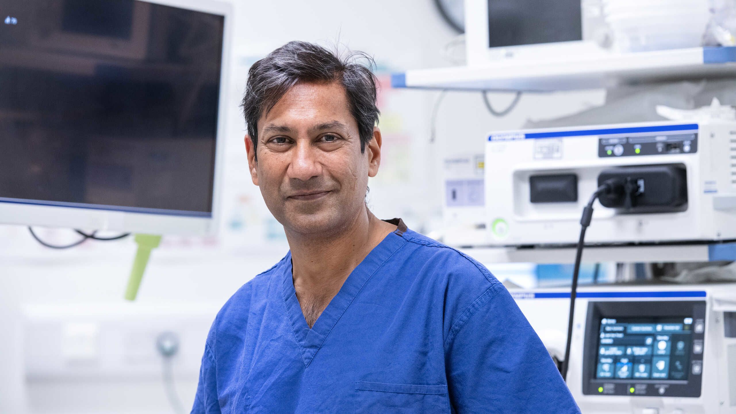 Professor Pallav Shah posing inside operating theatre at Chelsea and Westminster Hospital