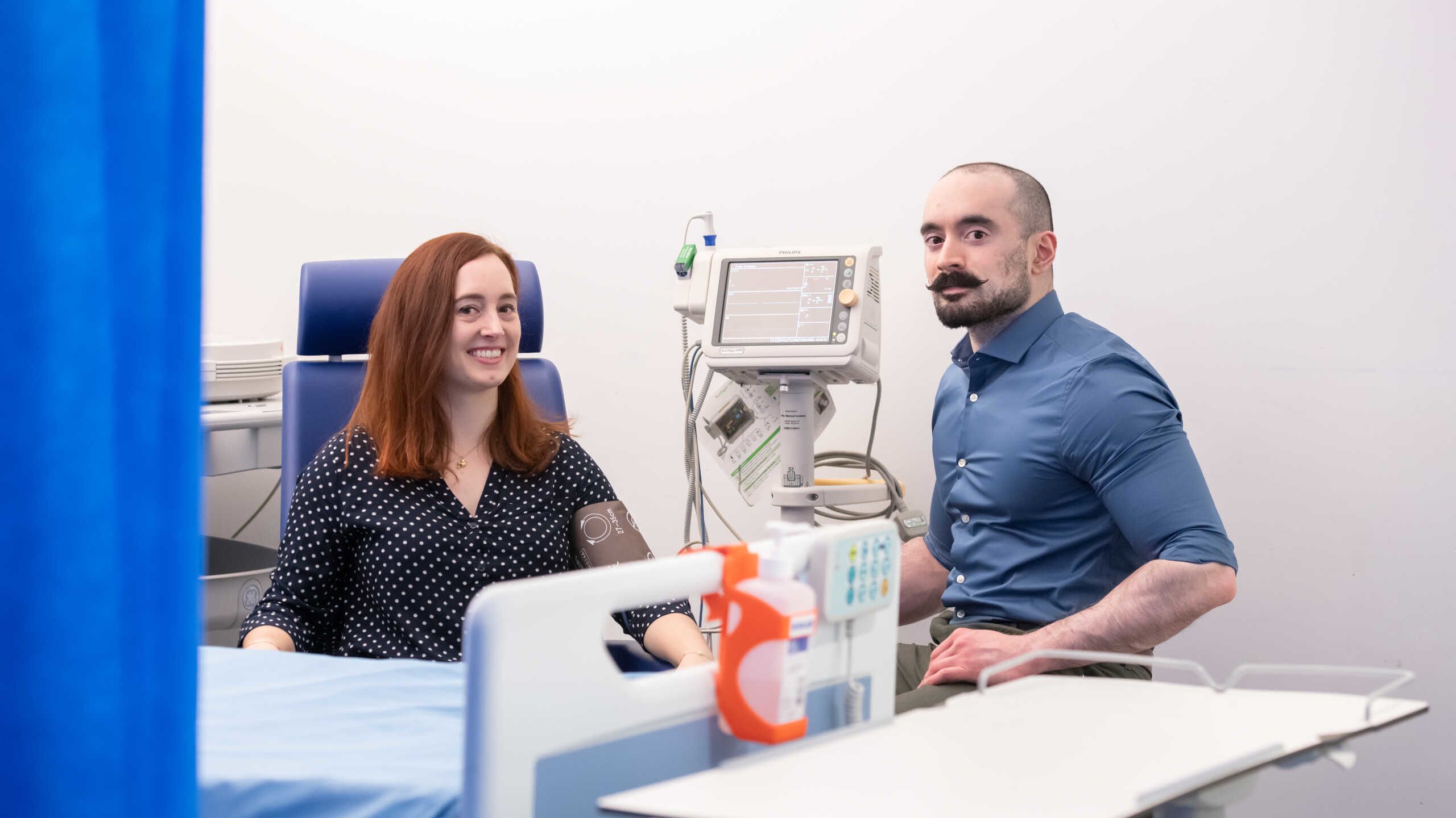 Juliette Hettema with research nurse smiling at camera