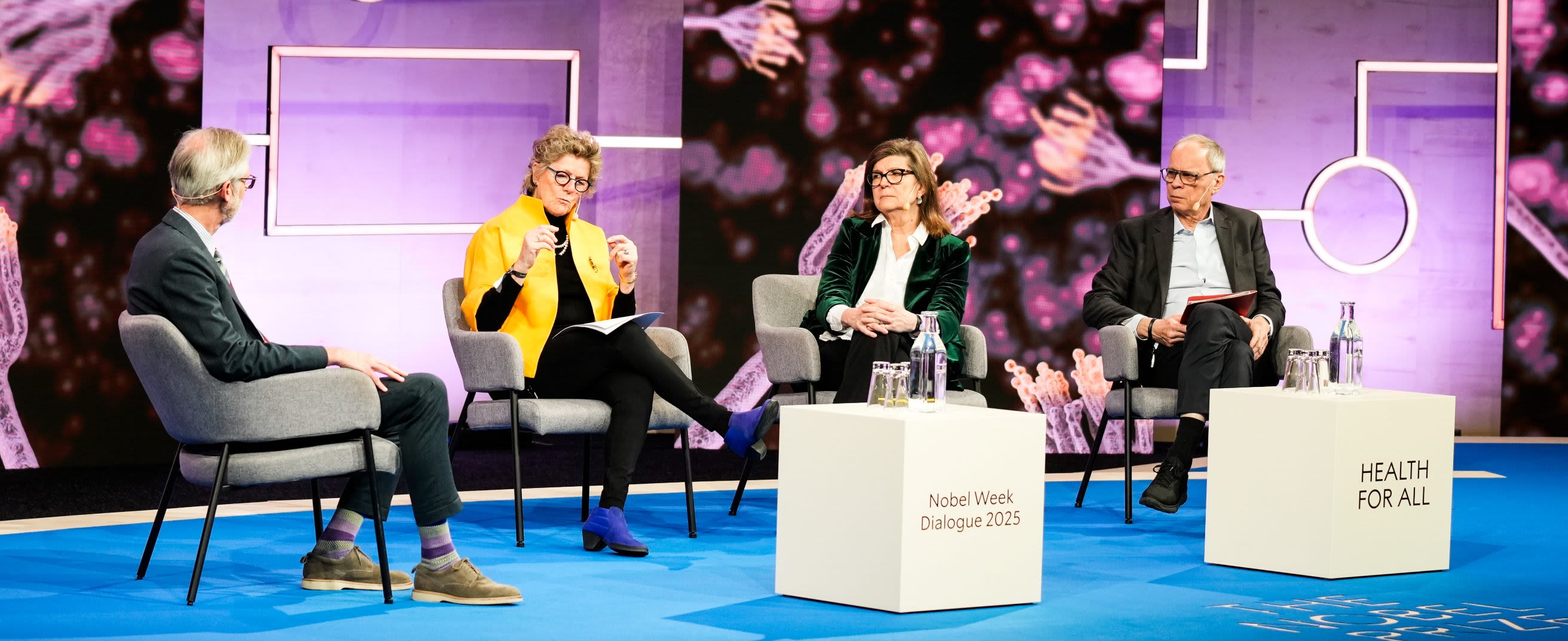 A seated panel of four people 