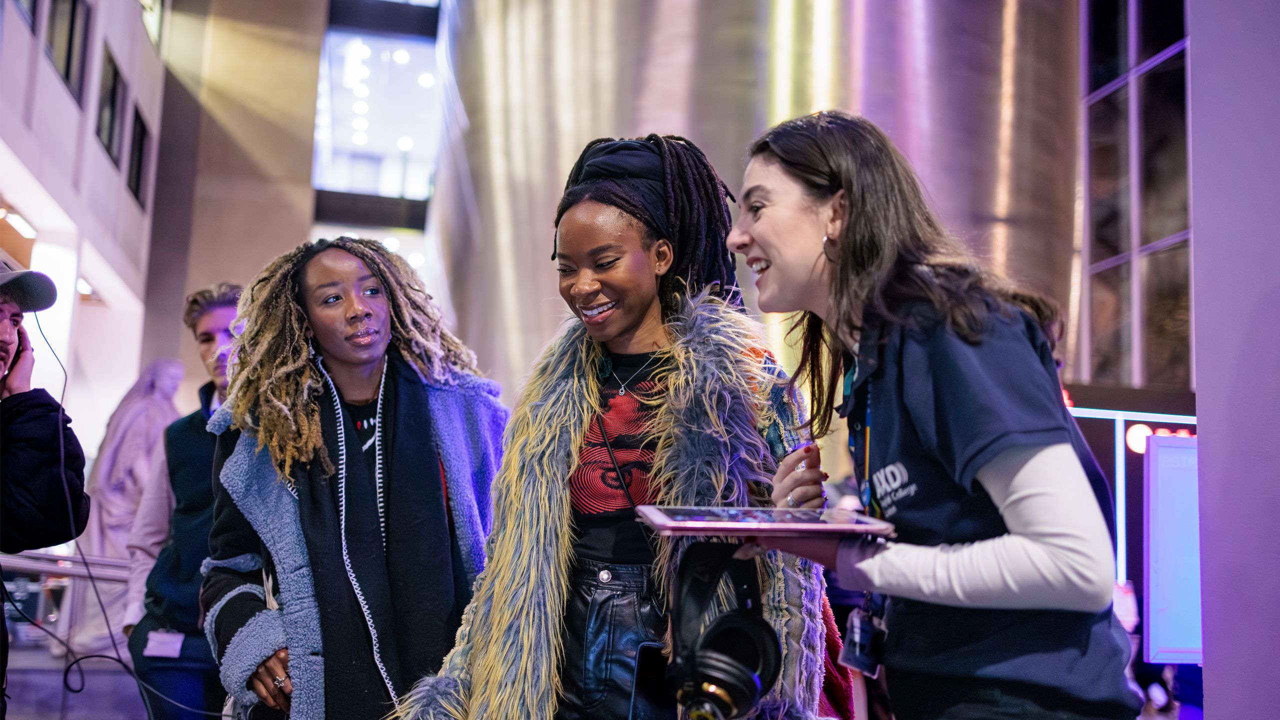 three women talking and smiling