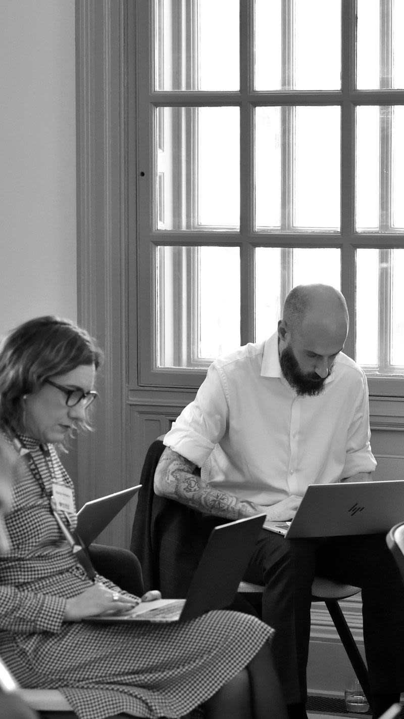 people sitting looking at laptops 2