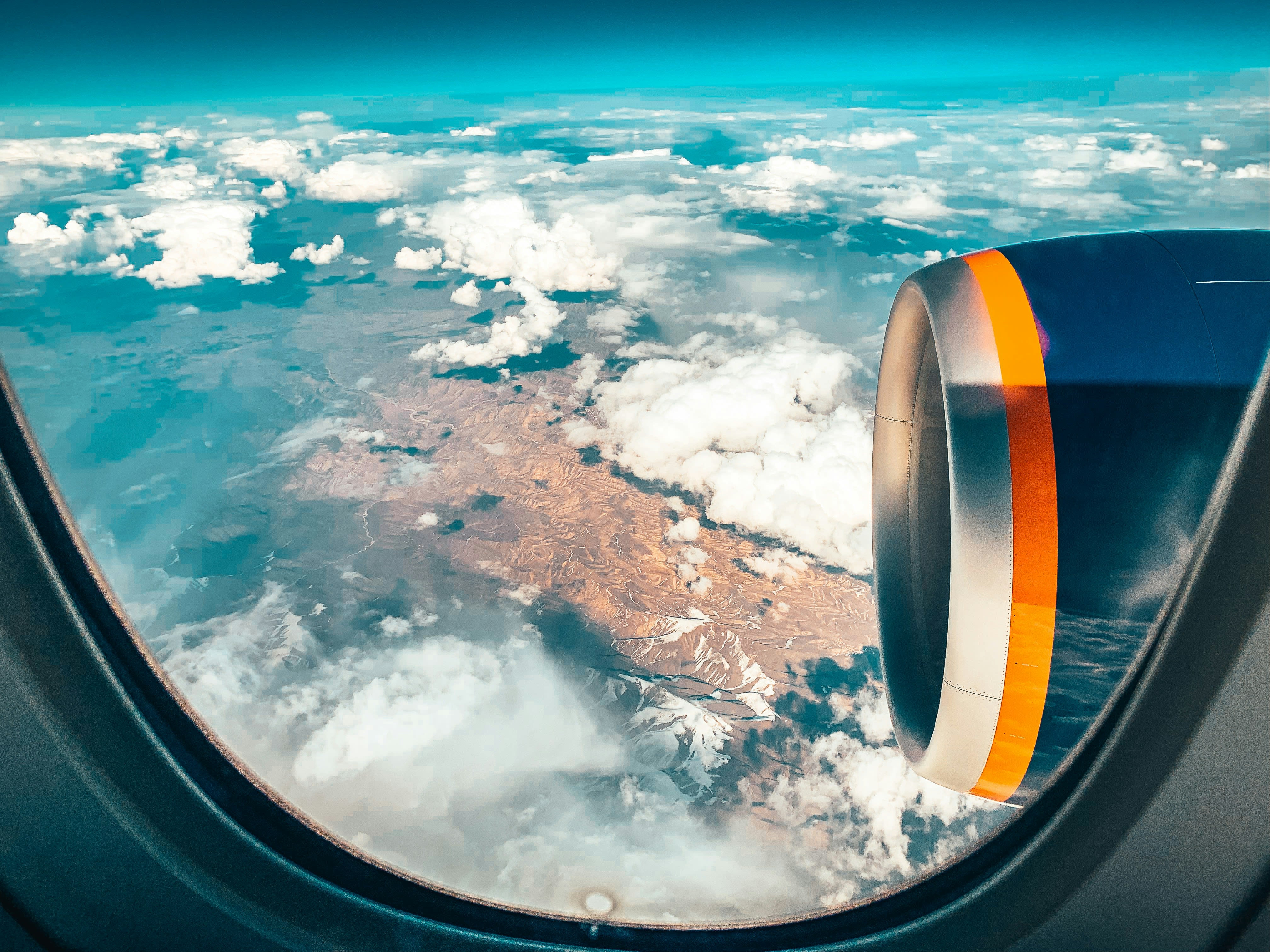 View out of an aeroplane window down to the ground