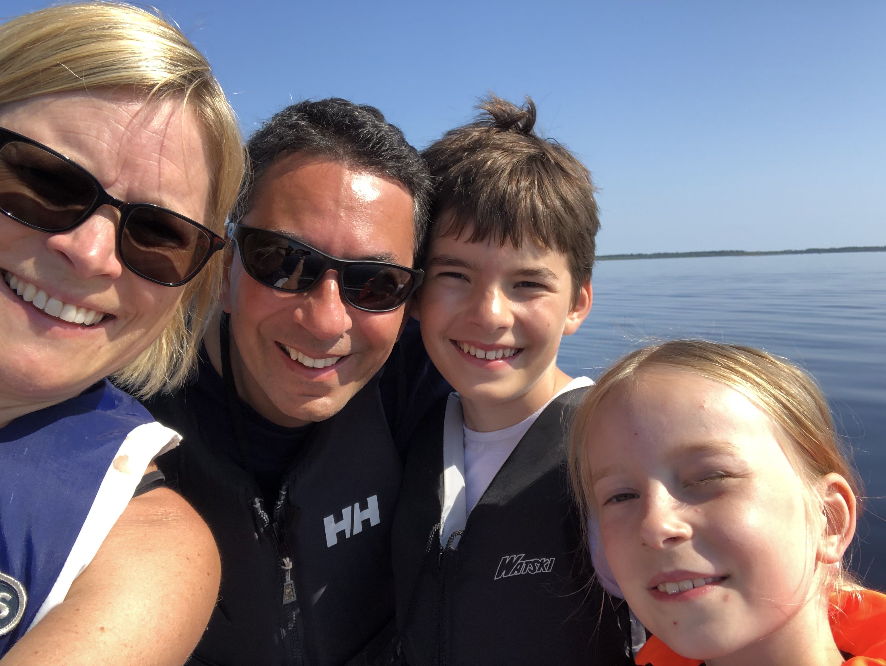 cecilia with her family on a lake