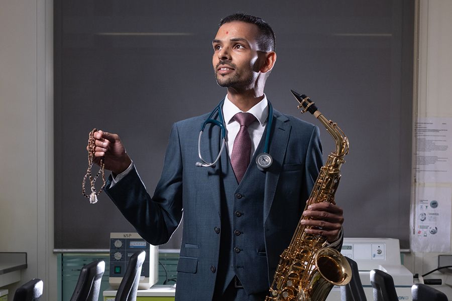 Kiran with saxophone and prayer beads