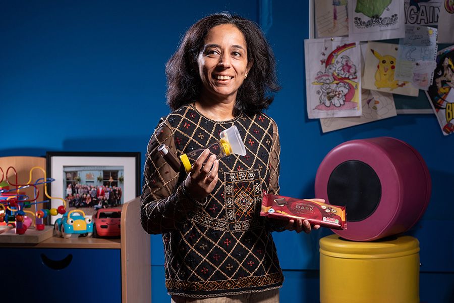 Sejal holds inhaler and chocolate