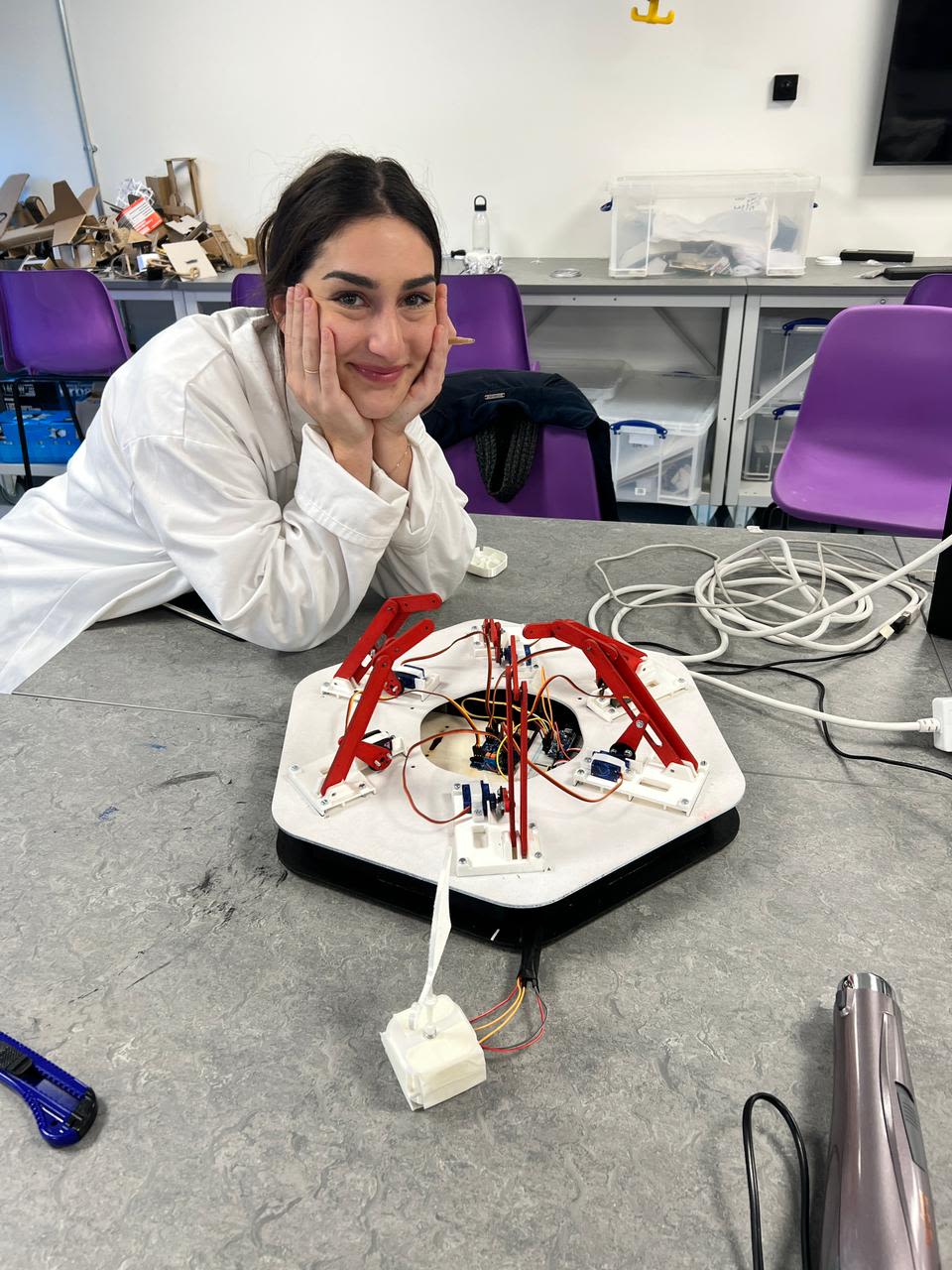 Abigail prototyping in the ACE workshop for her group project