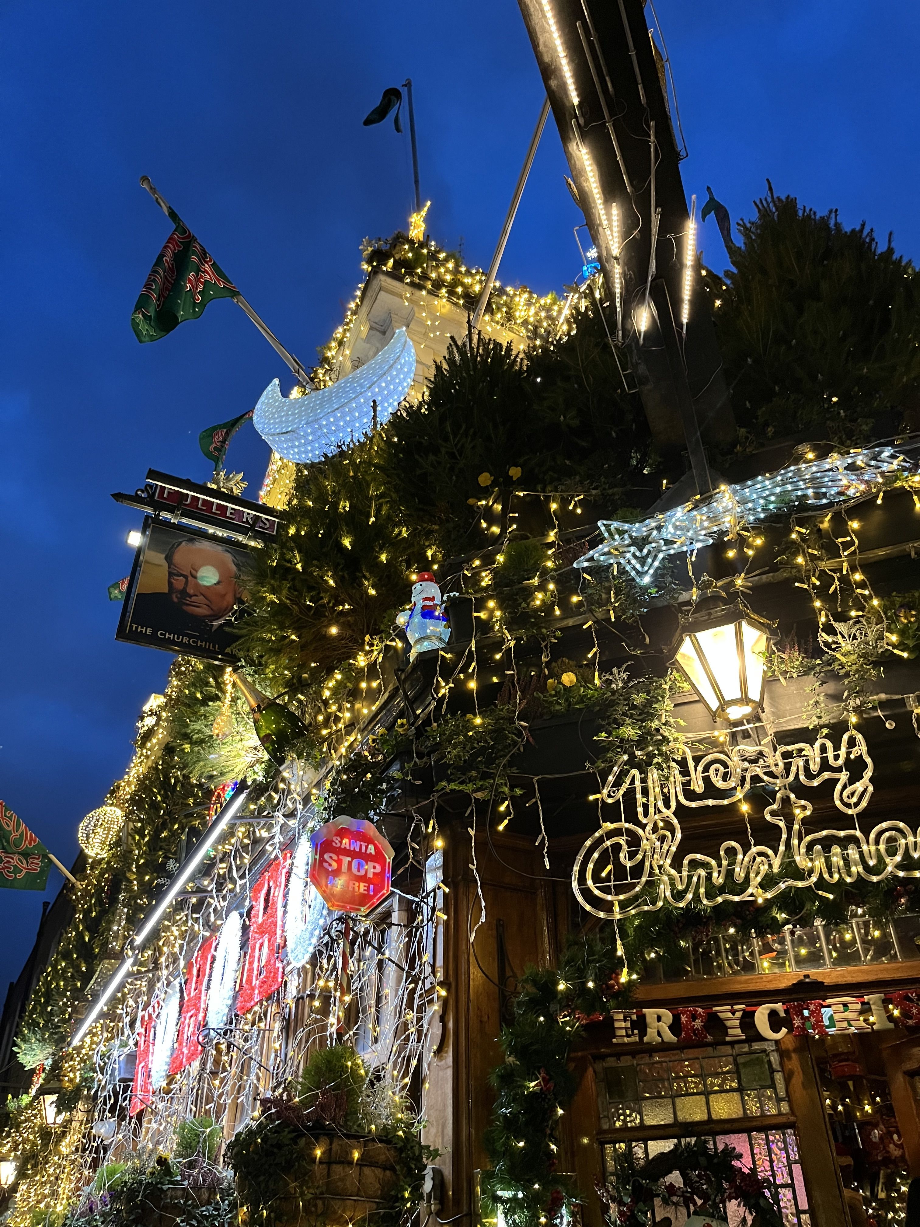 Christmas decoration and light display outside a pub.