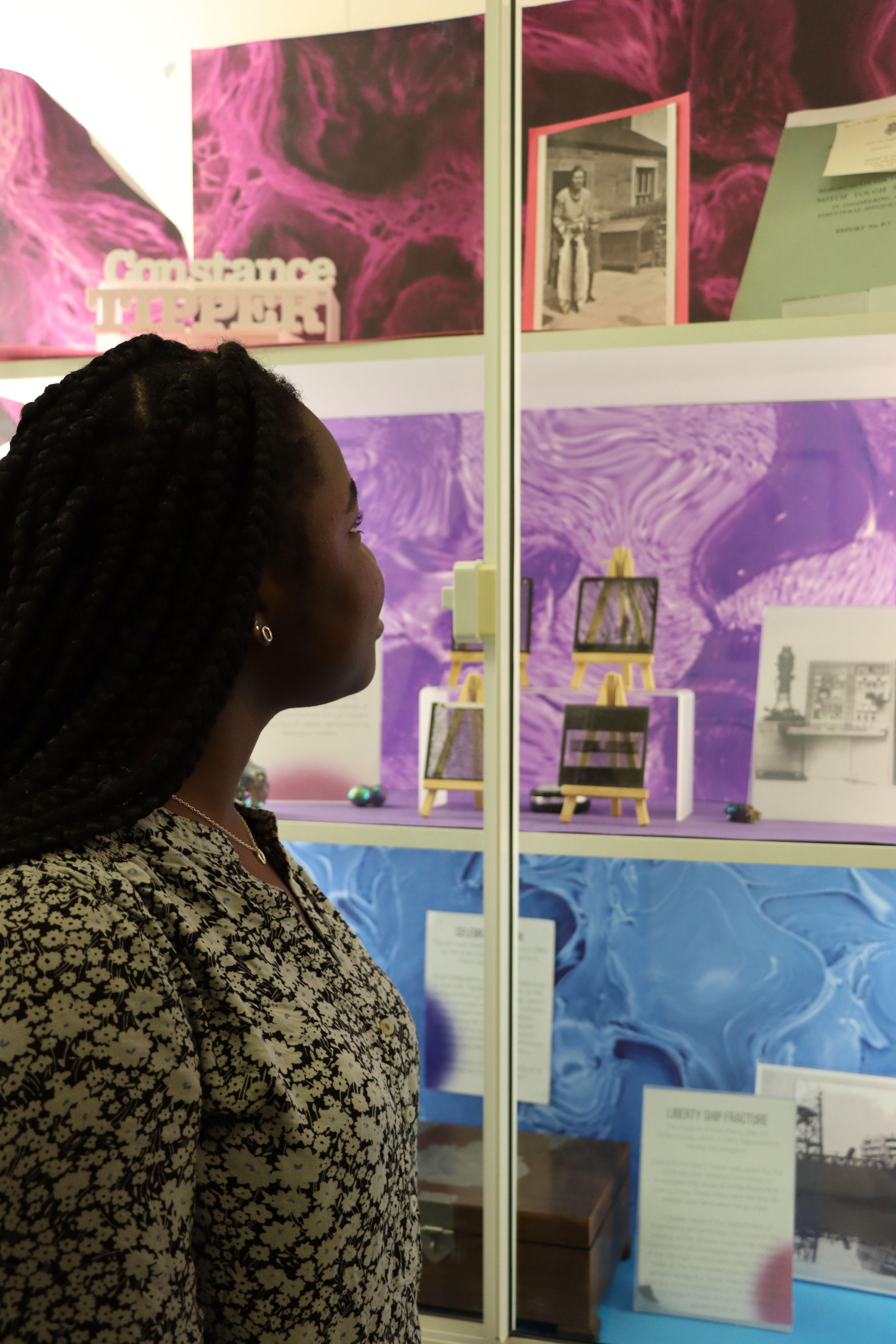 Amina looking at a display in the department