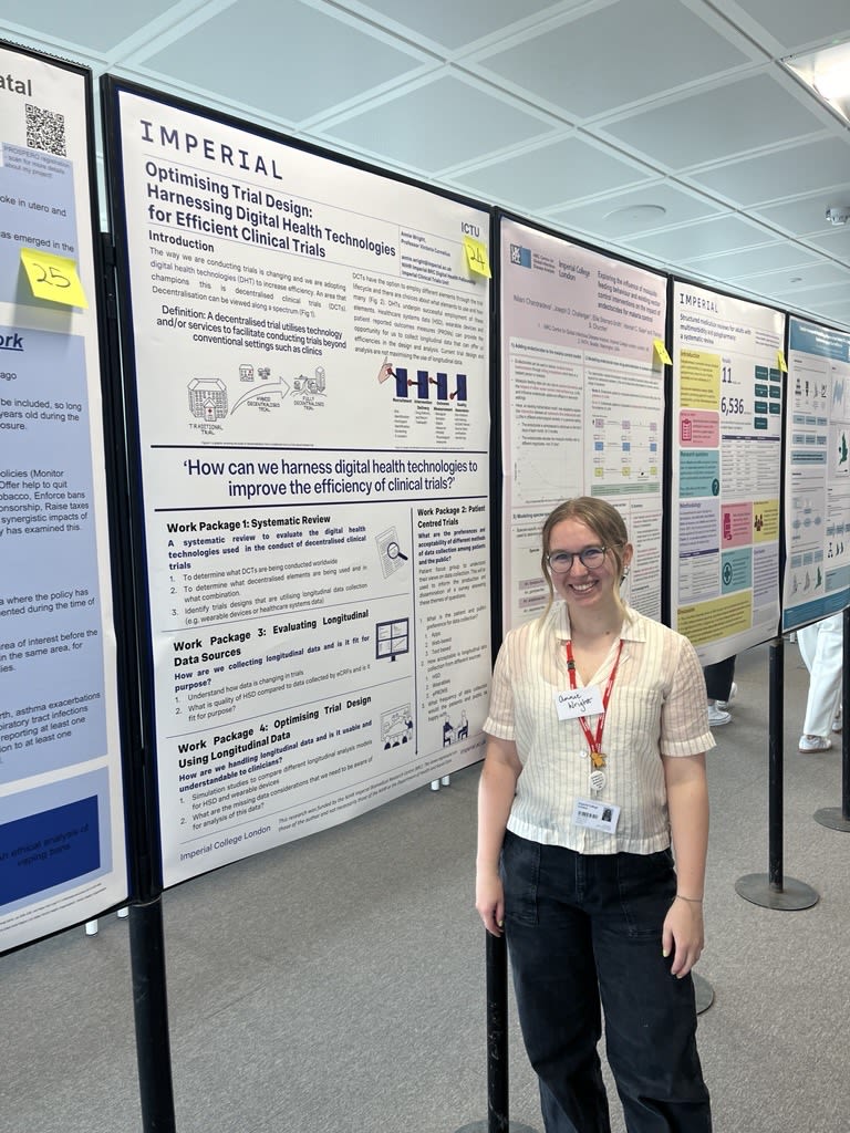 Annie with a poster talking about 'How we can harness digital health technologies to improve the efficiency of clinical trials?'