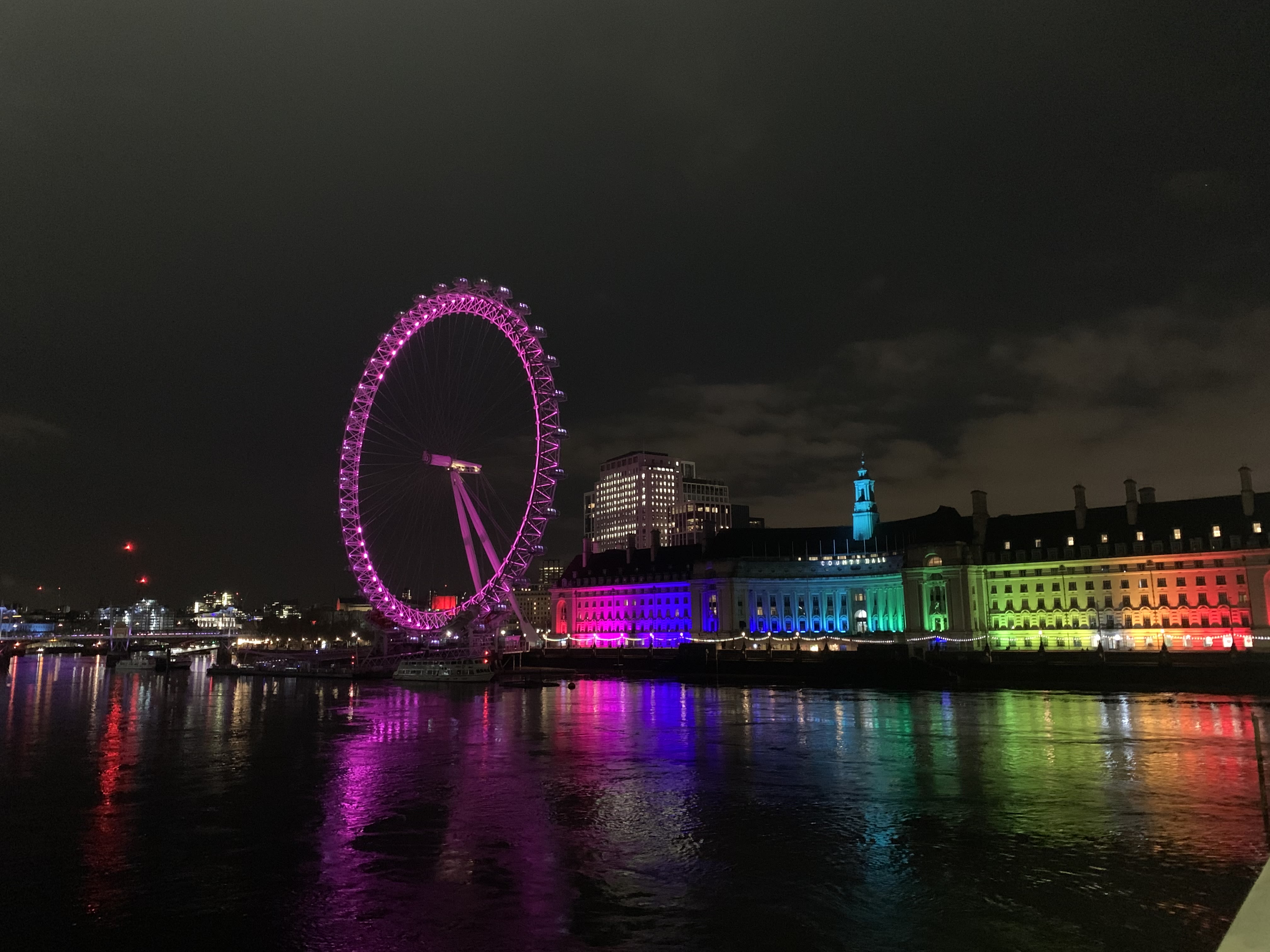 London Southbank lit up in the lights of the LGBT+ flag