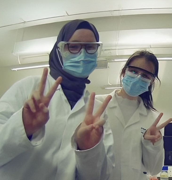 Cristiana with a coursematr wearing PPE