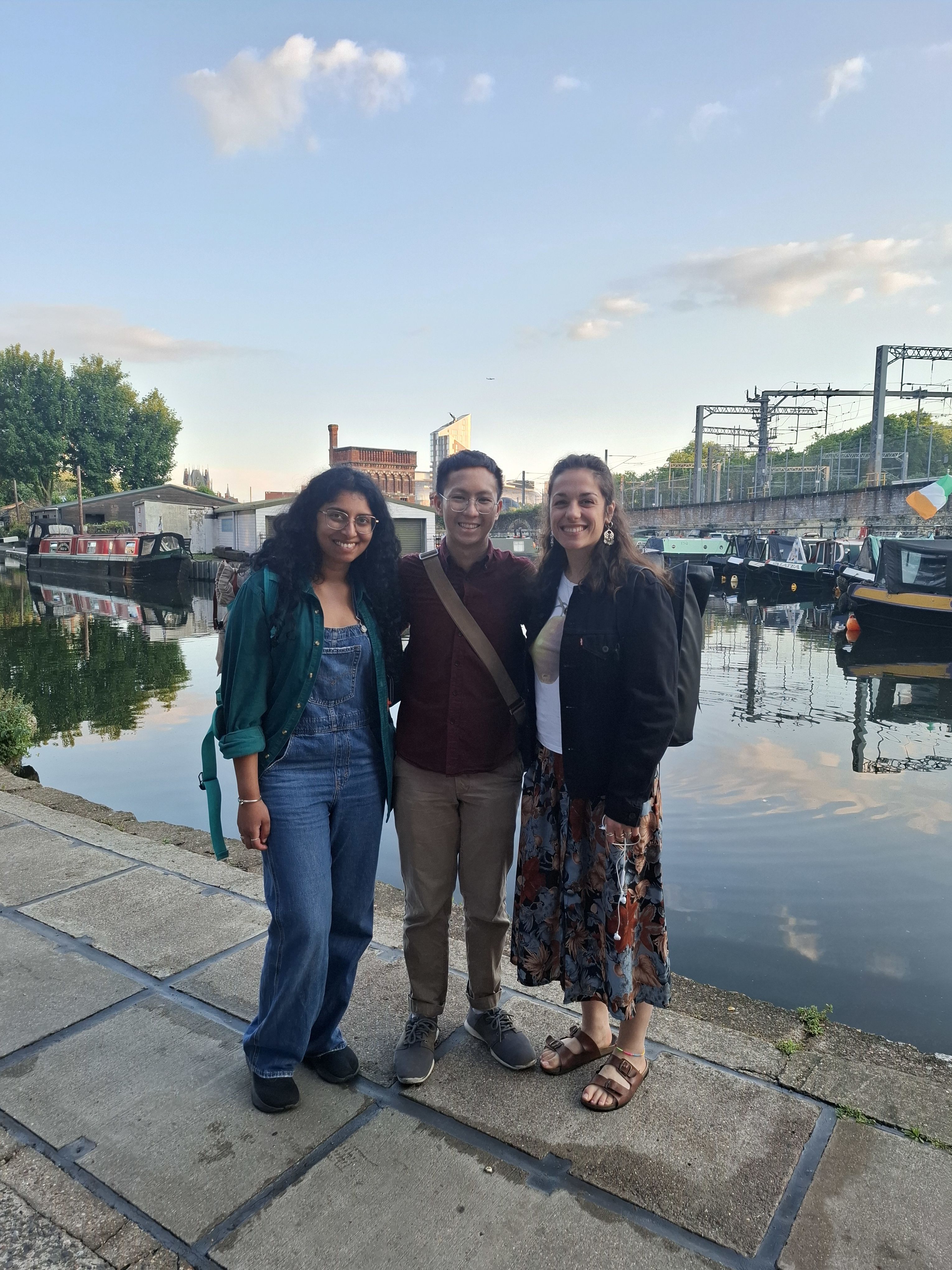 JJ with two friends standing by a canal